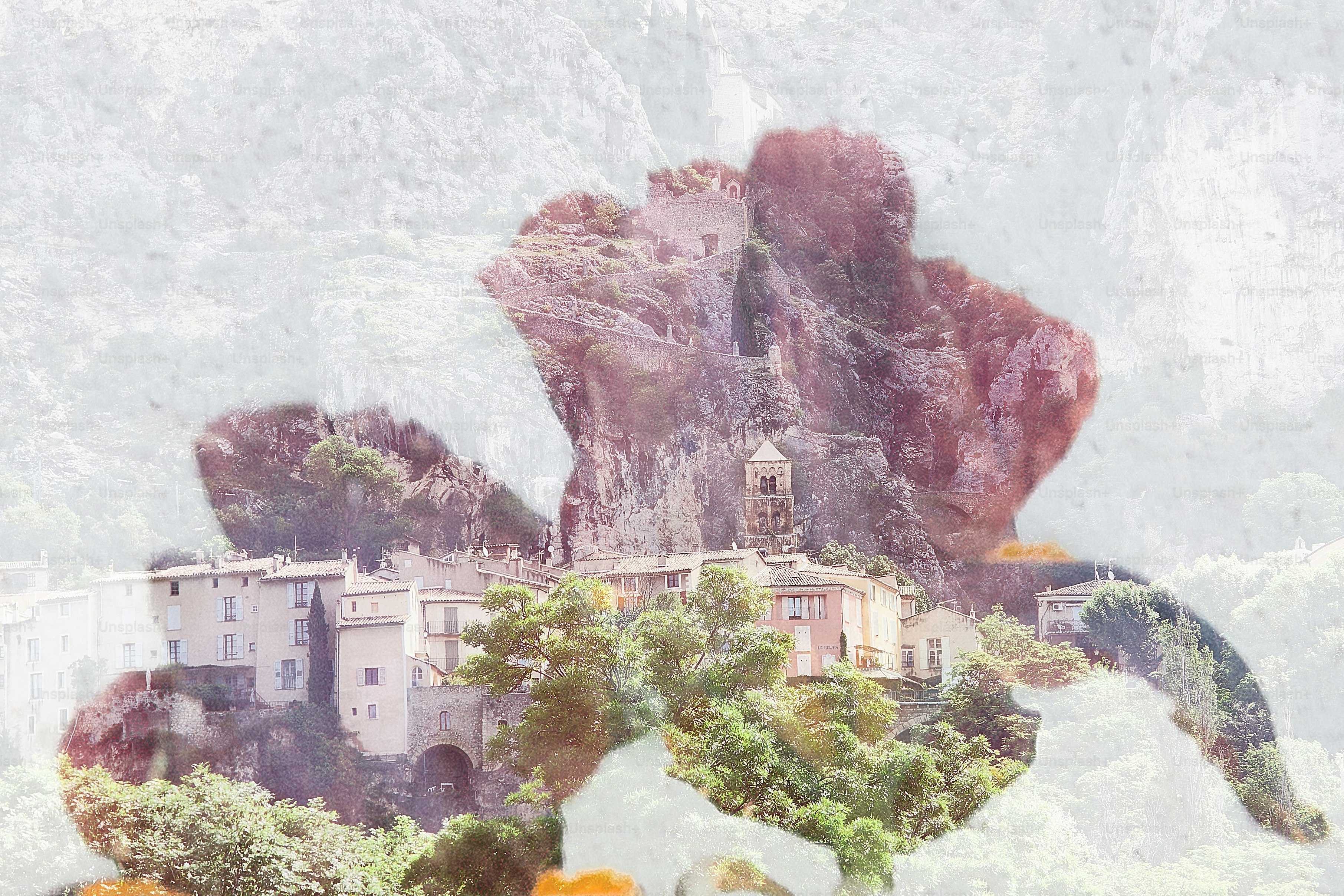 Double exposure of village nestled in rocky mountains