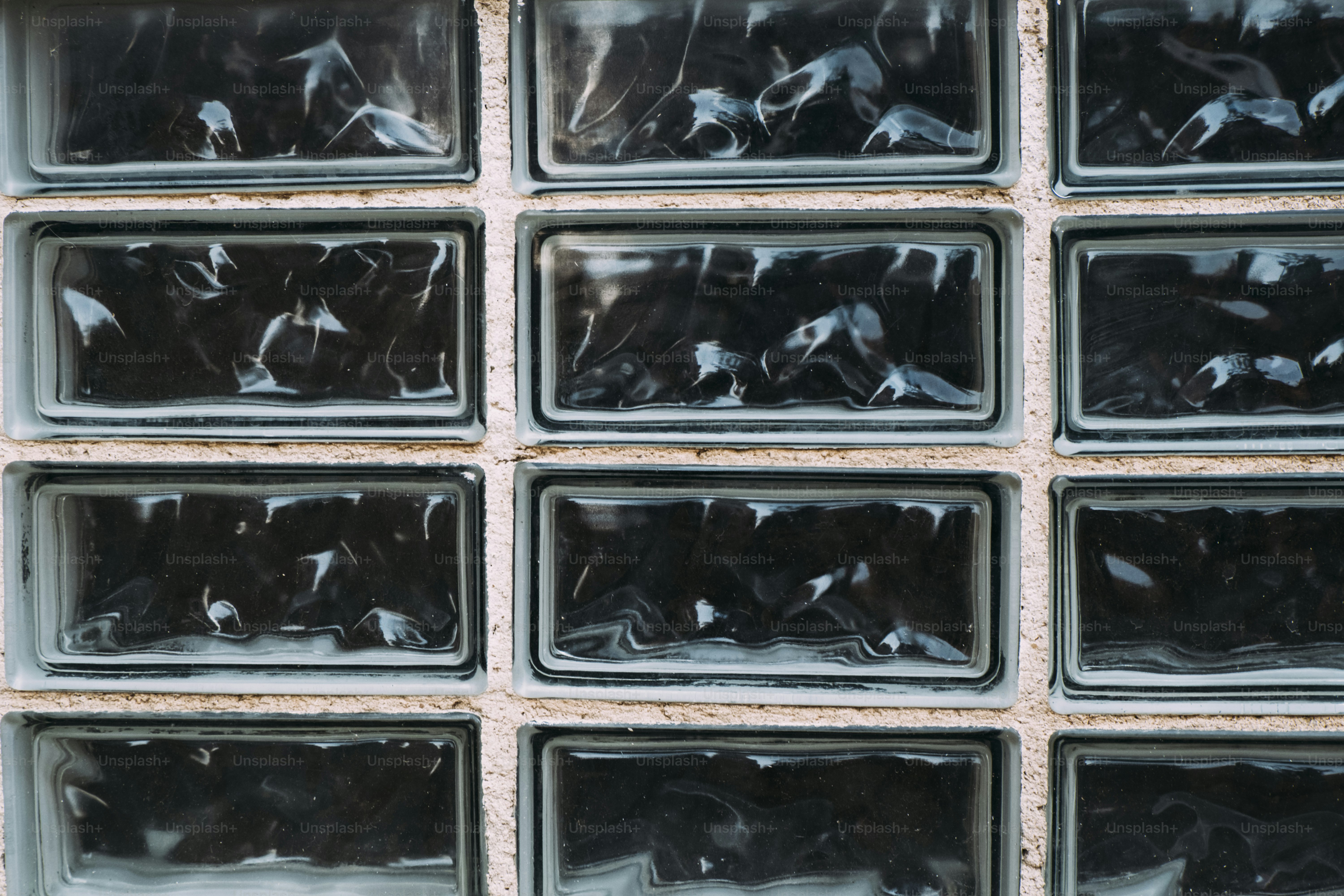 Close-up of textured glass blocks in a wall.