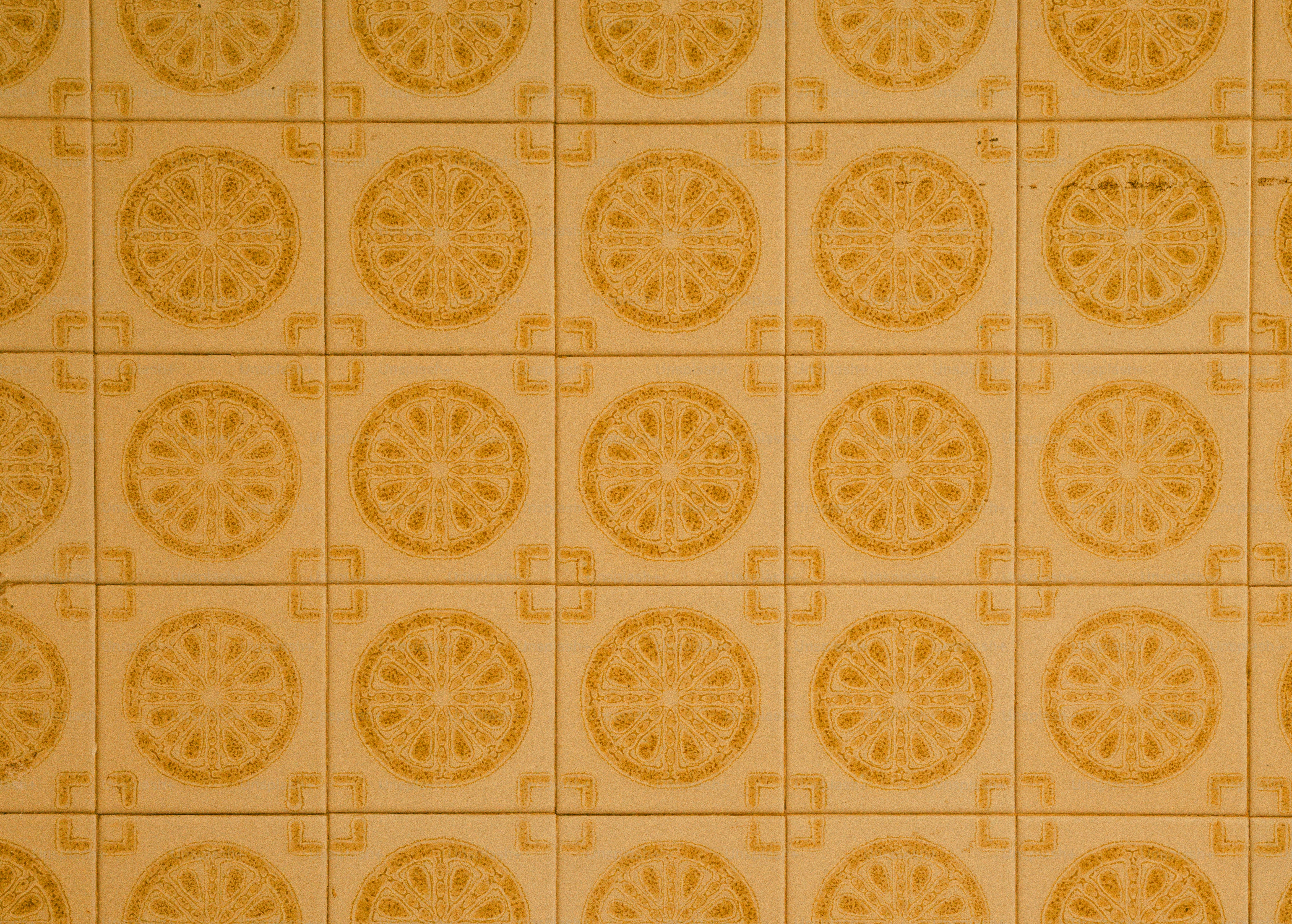 Red and yellow square mosaic tiles with textured patterns. photo ...