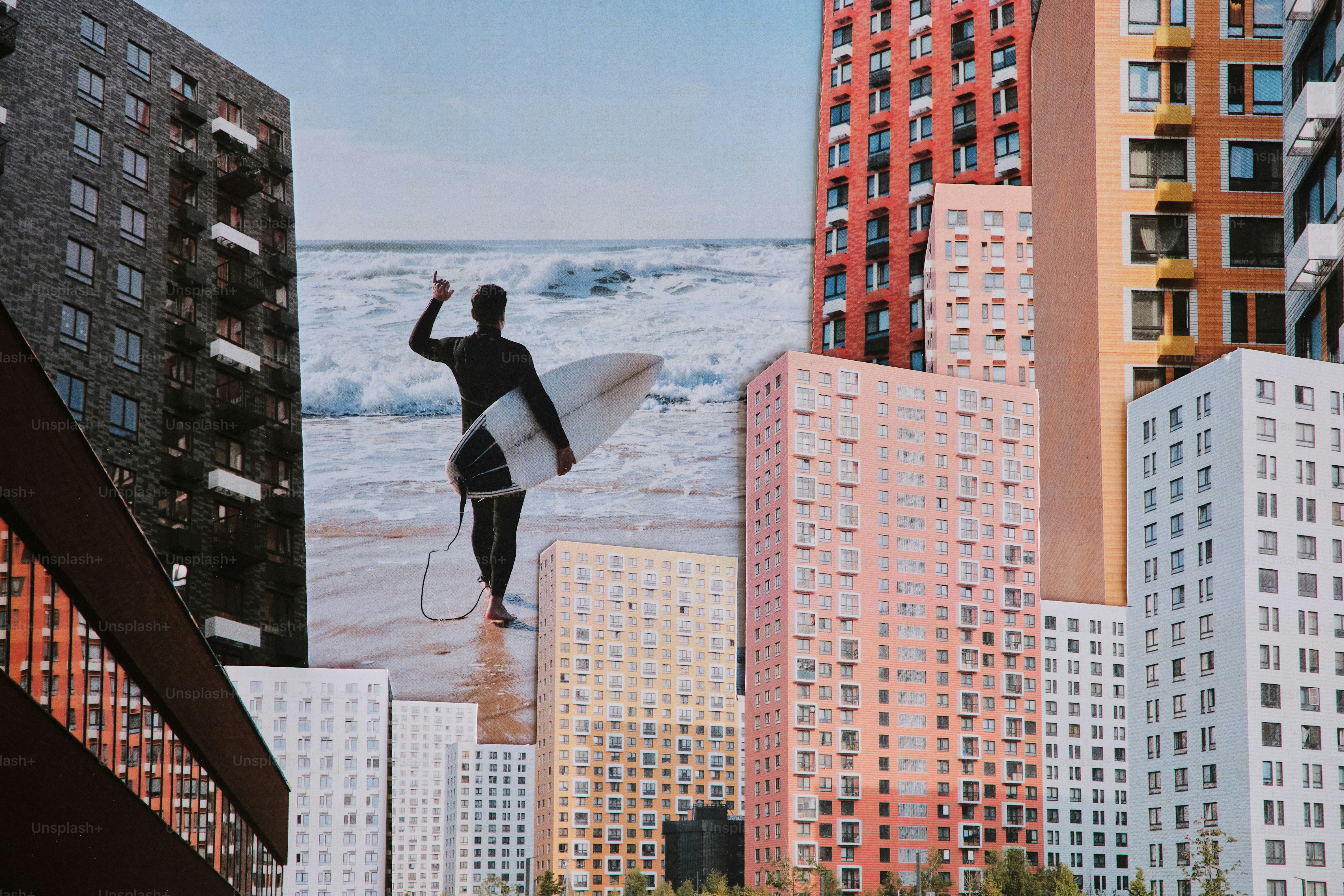 Surfer walking on beach with cityscape background