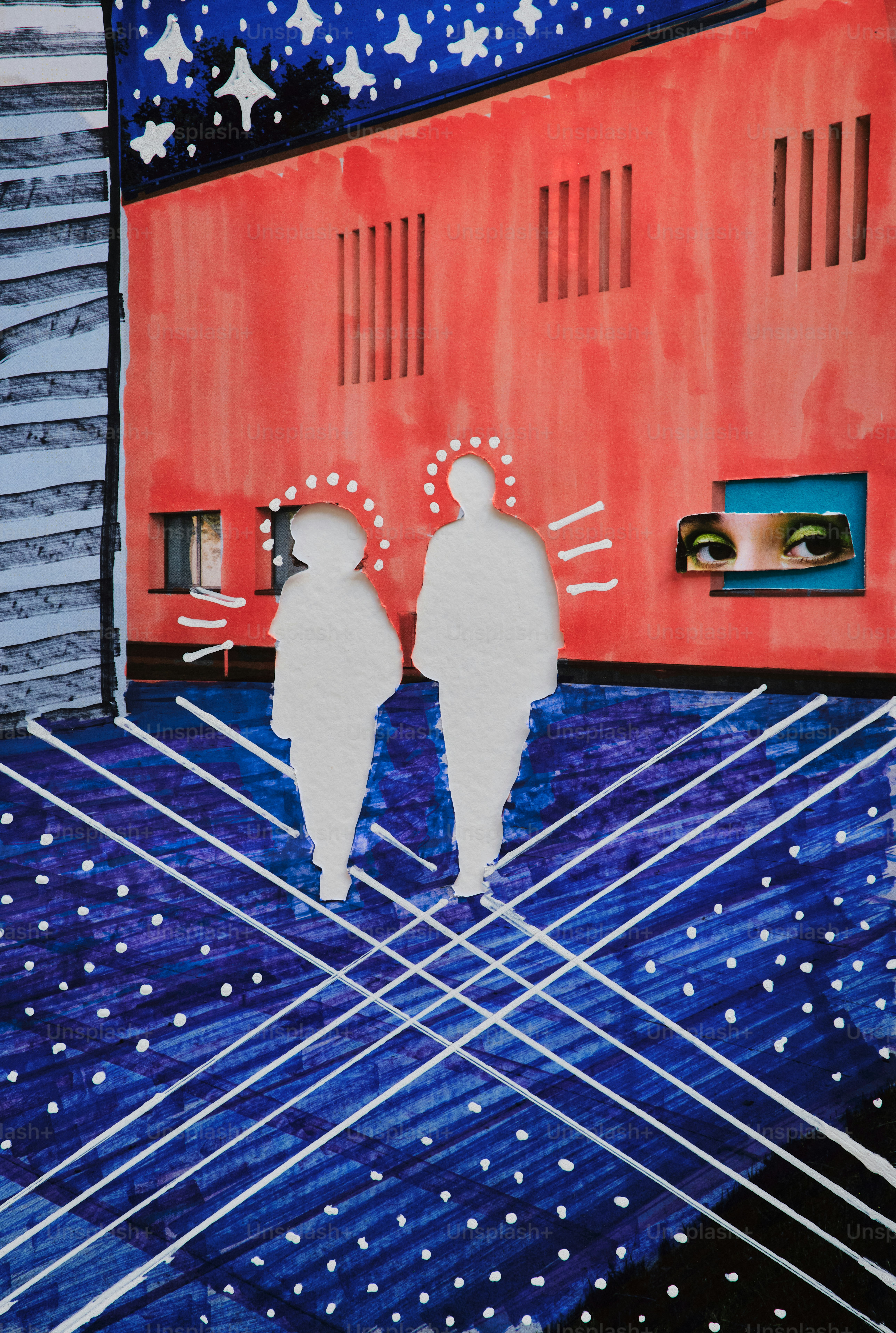 Two figures stand on a patterned blue surface.