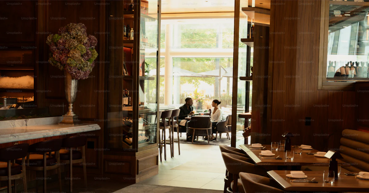 Elegant restaurant interior with dining tables and people. photo ...