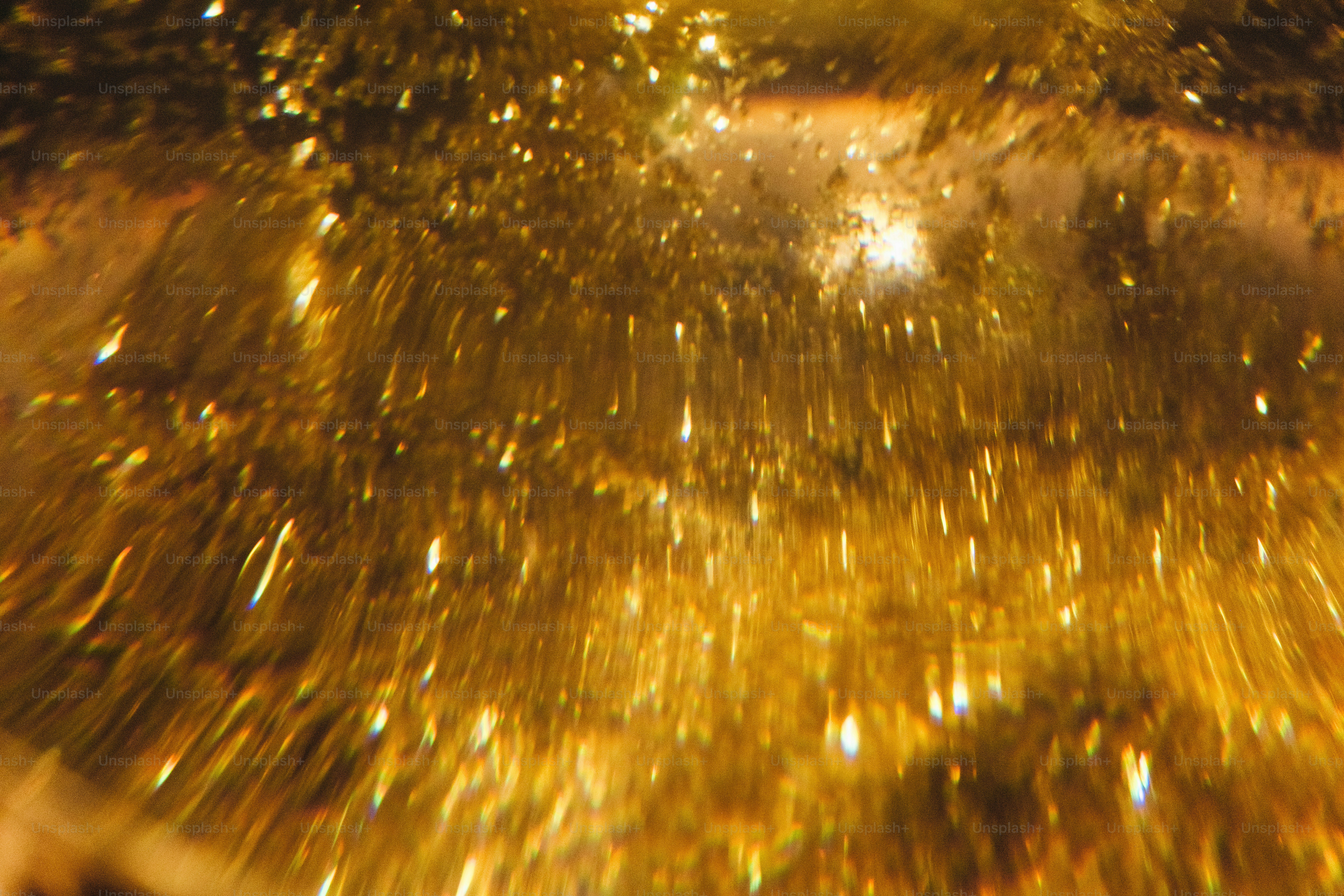 Abstract golden sparkles with blurred motion effect