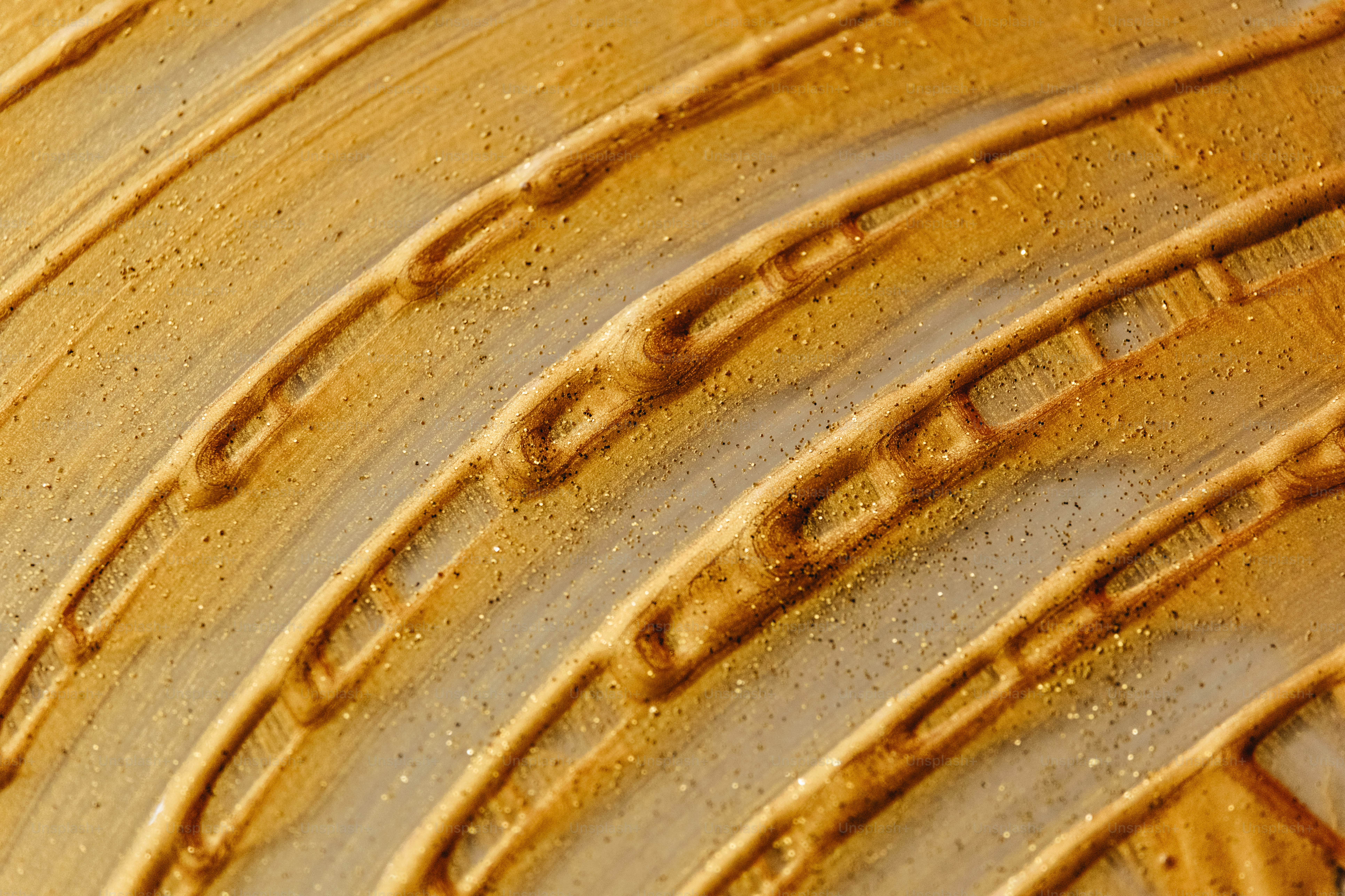 Close-up of textured golden paint strokes