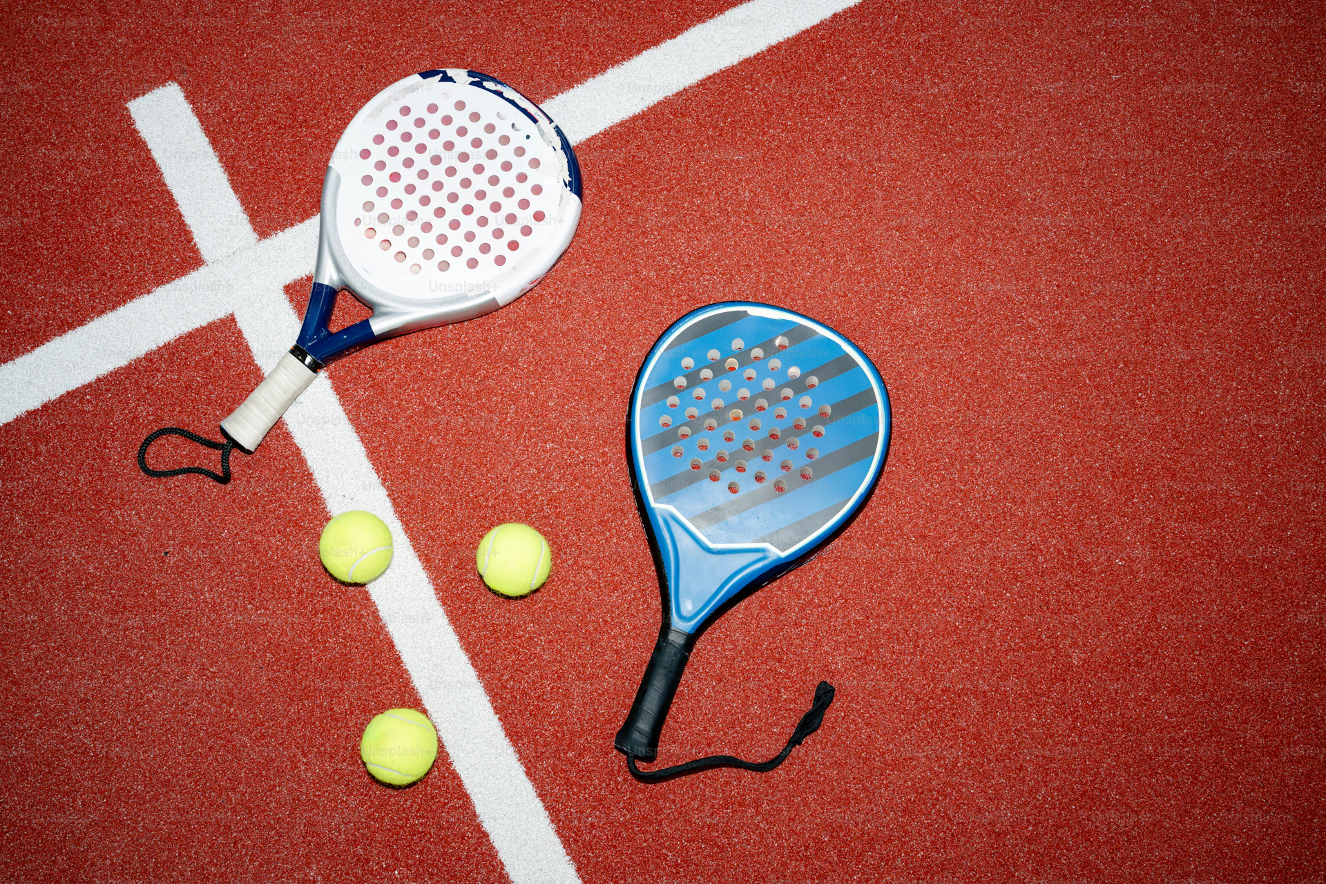 Padel rackets on blue court