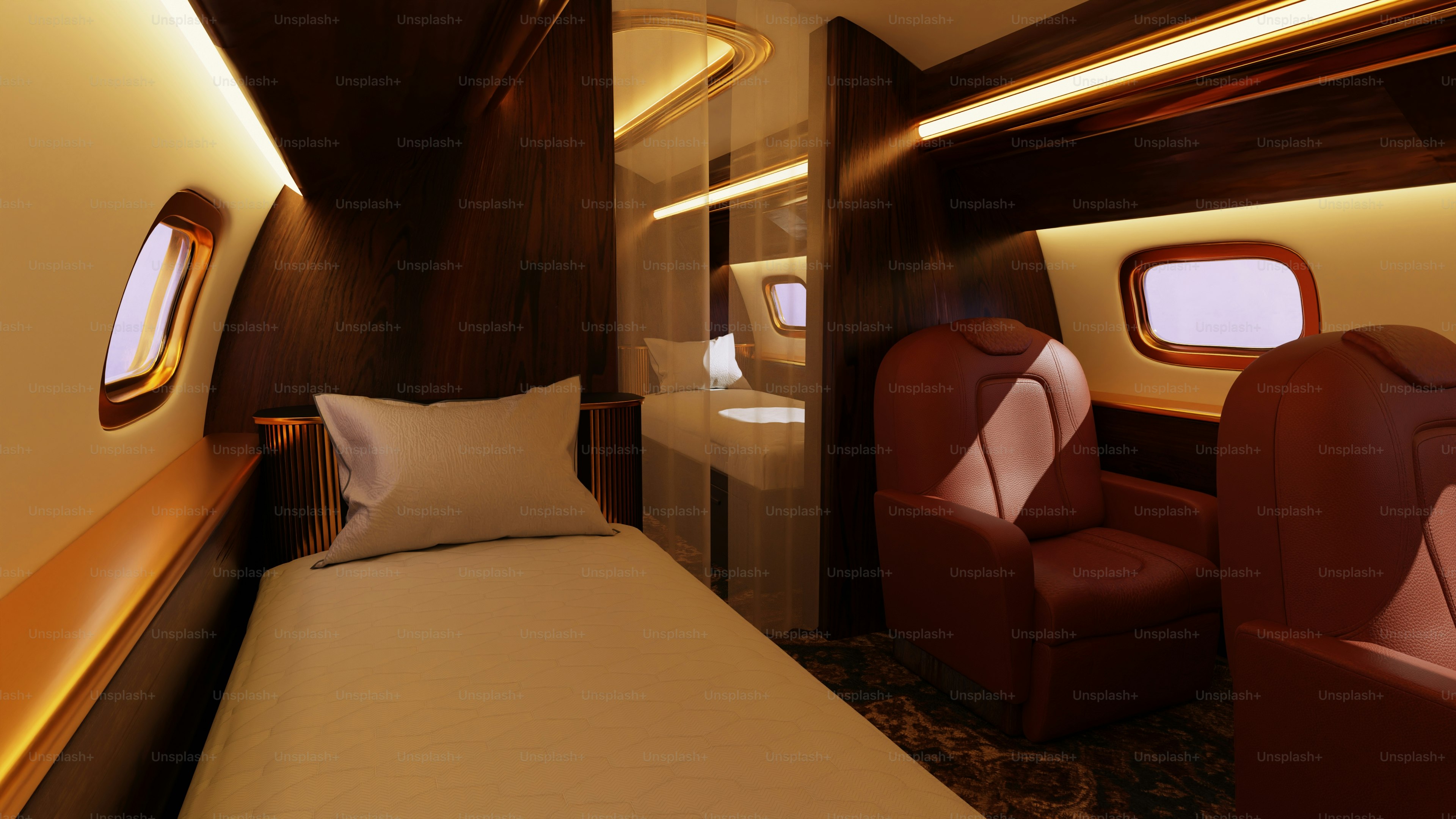 Luxurious private jet interior with seating and bed.