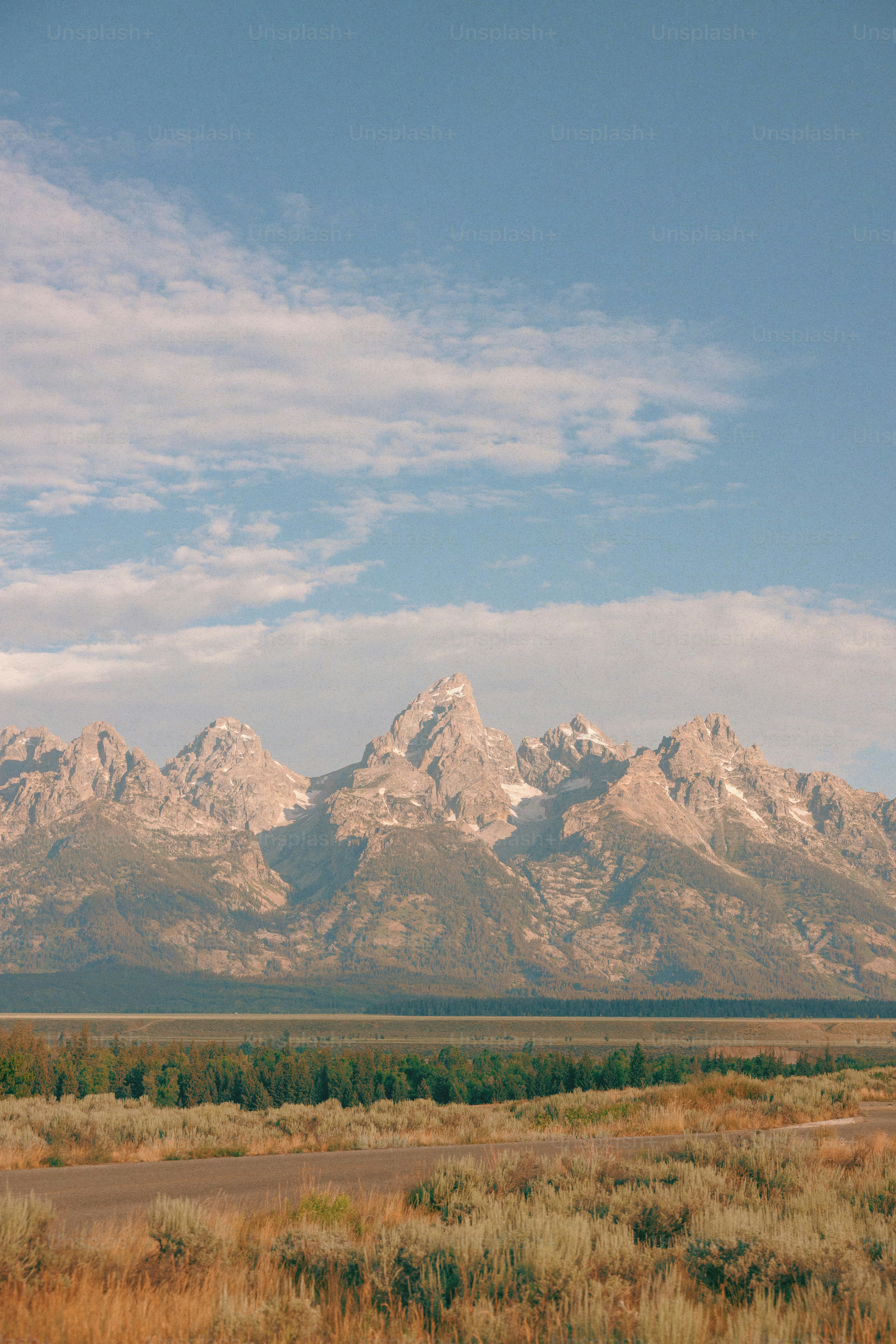Majestic mountain range under a clear blue sky. photo – Travel Image on ...