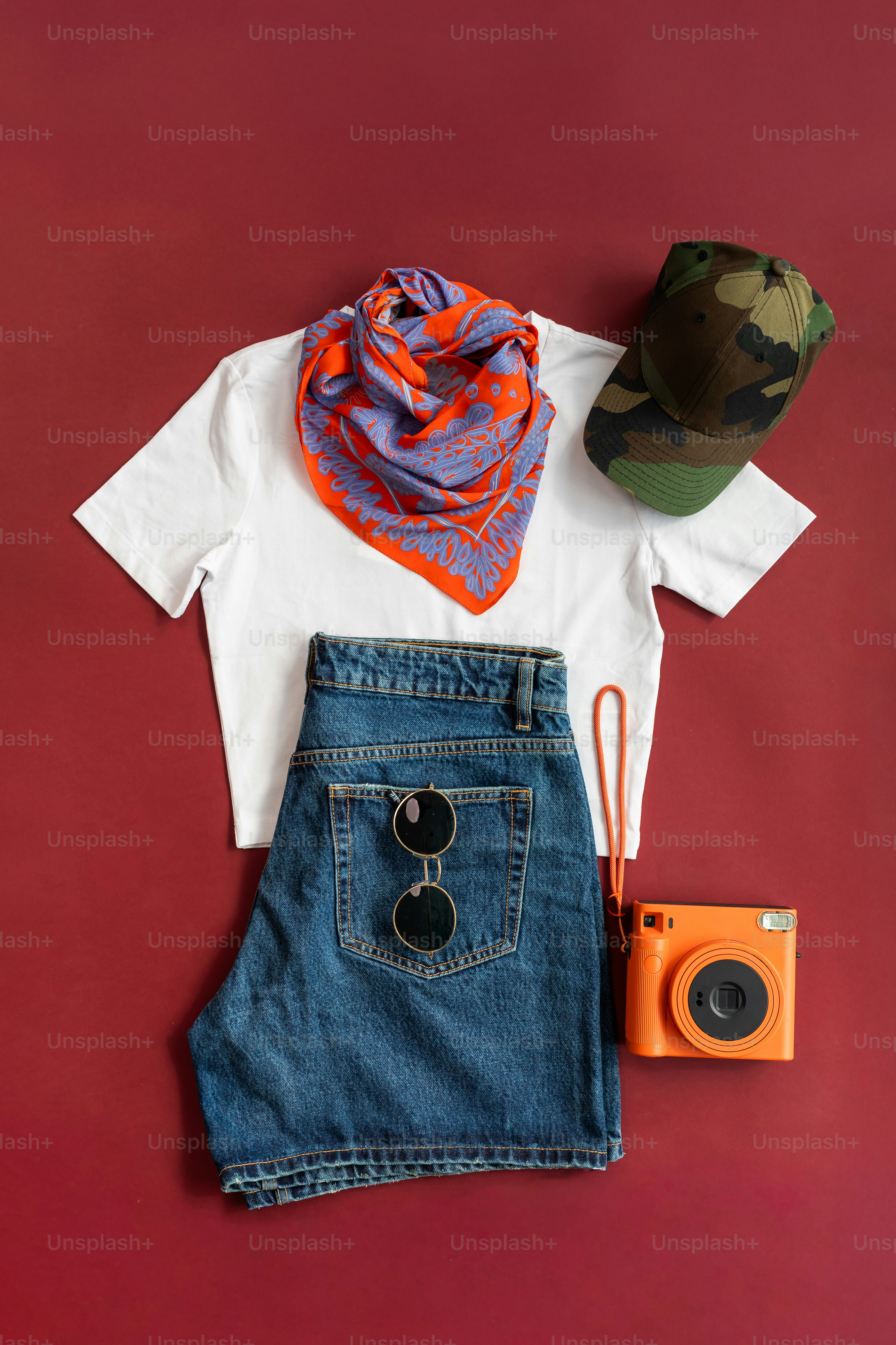 Flat lay of casual summer outfit with accessories