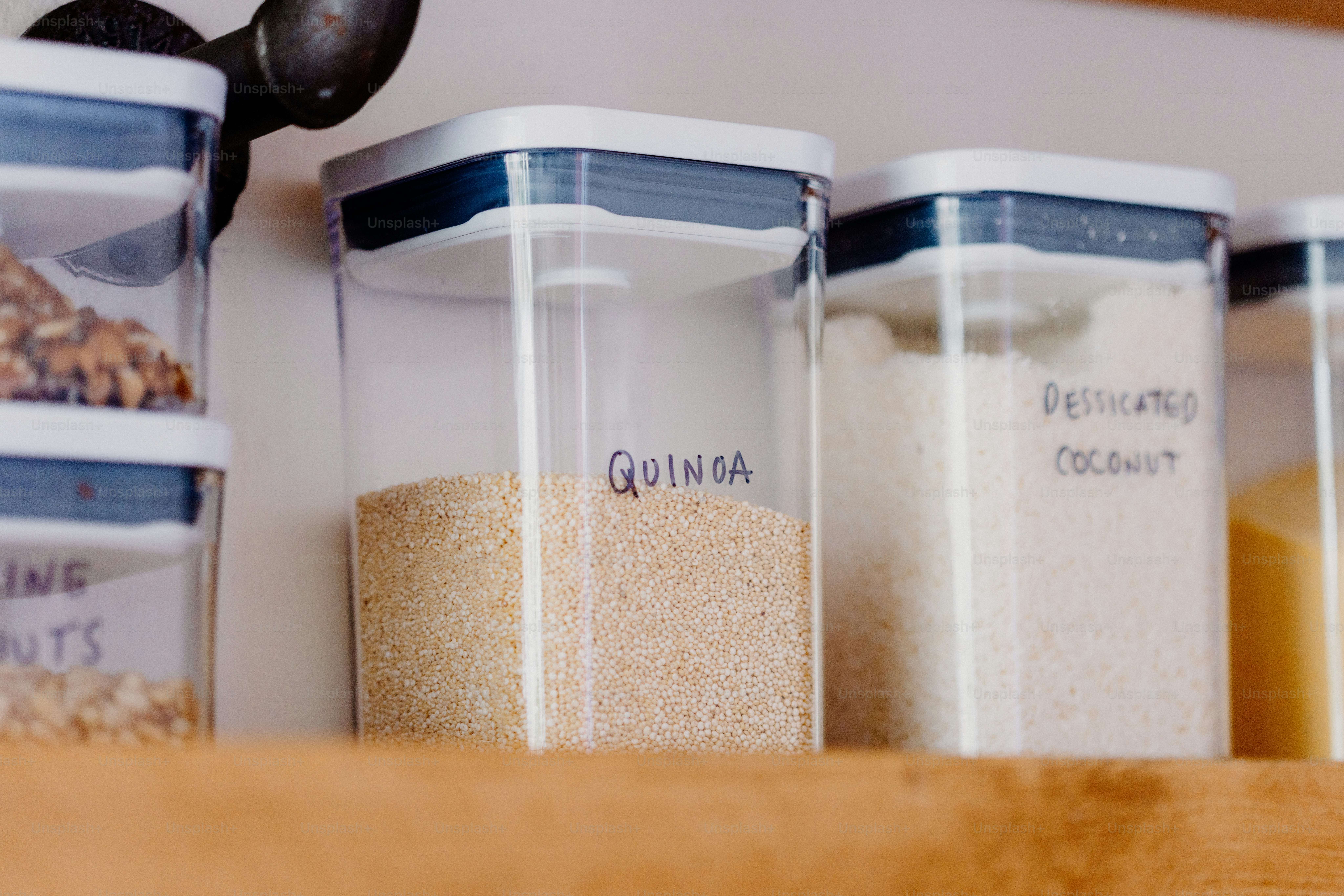 Clear kitchen containers filled with dry goods. photo – Image on Unsplash