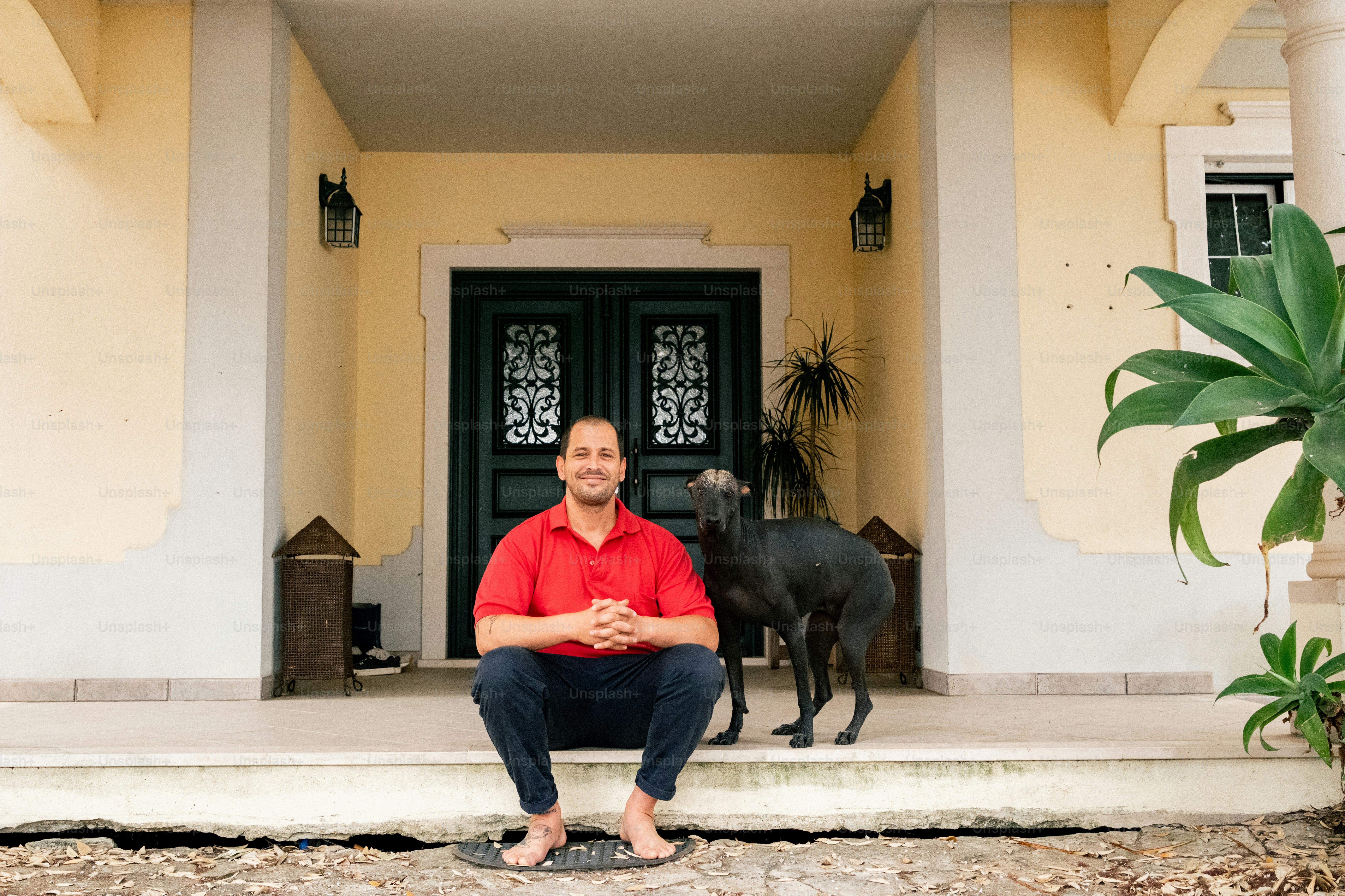 Man and dog on porch steps