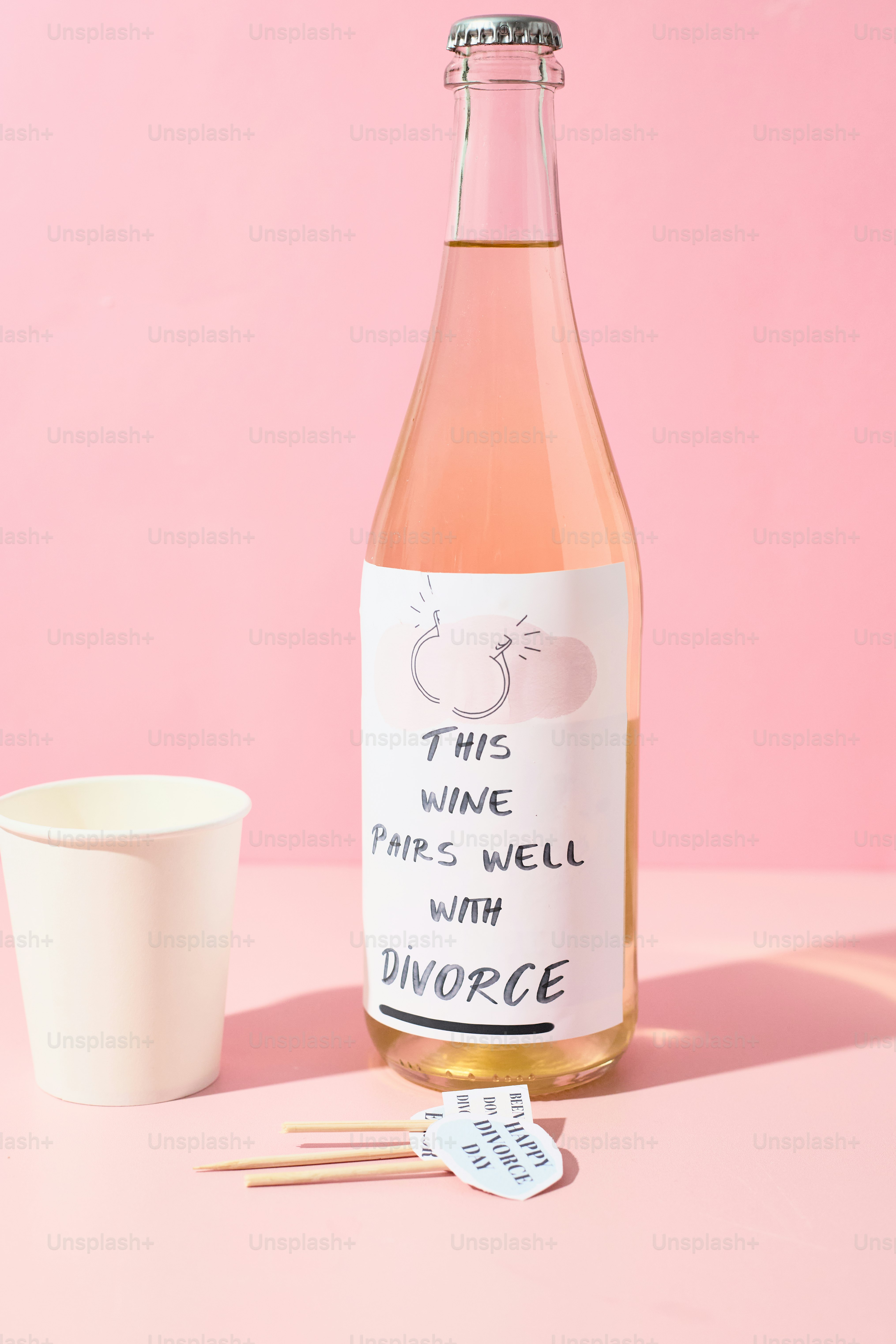 Bottle of wine with divorce-themed label and cup