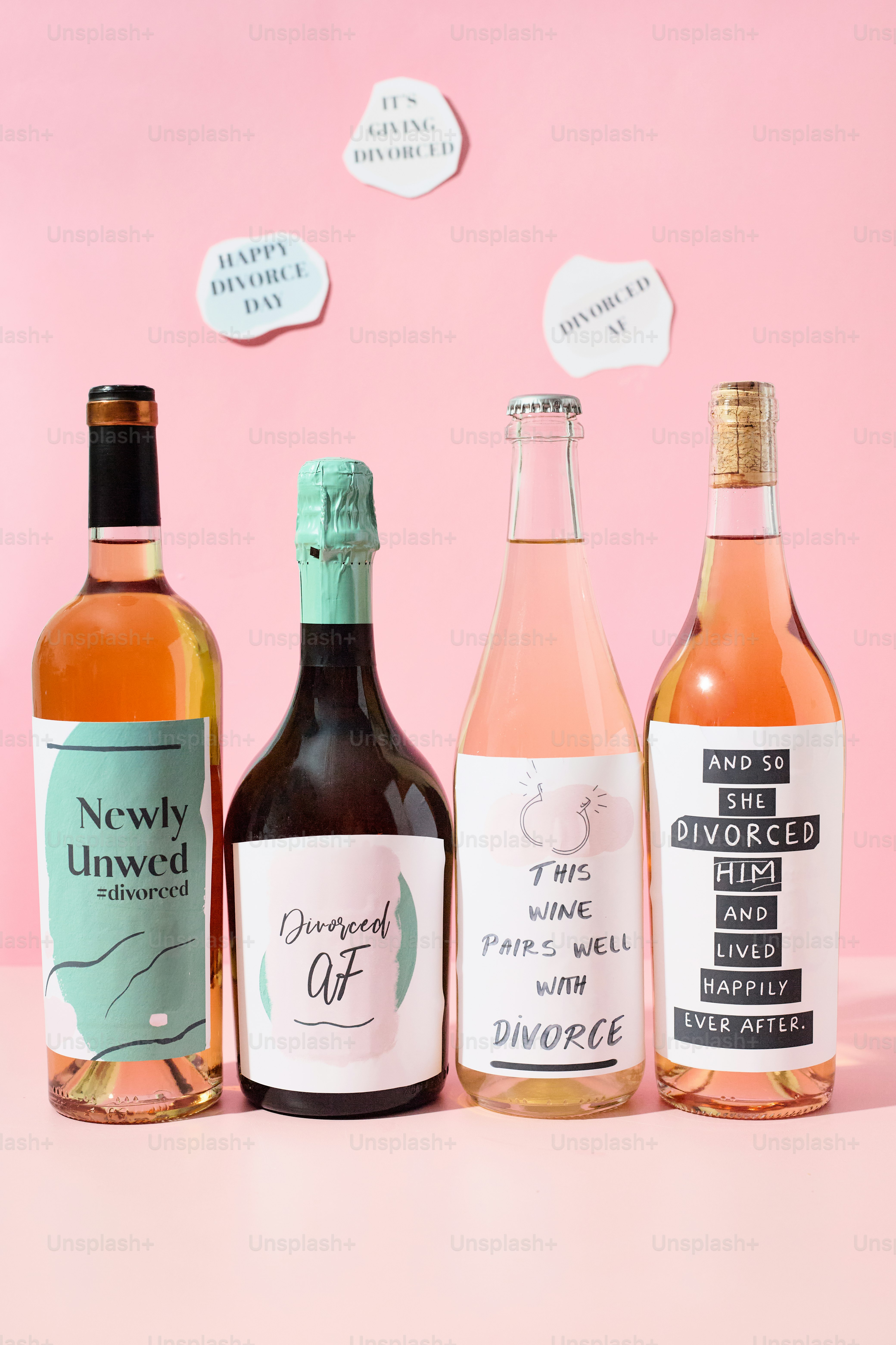 Four bottles of wine with divorce-themed labels.