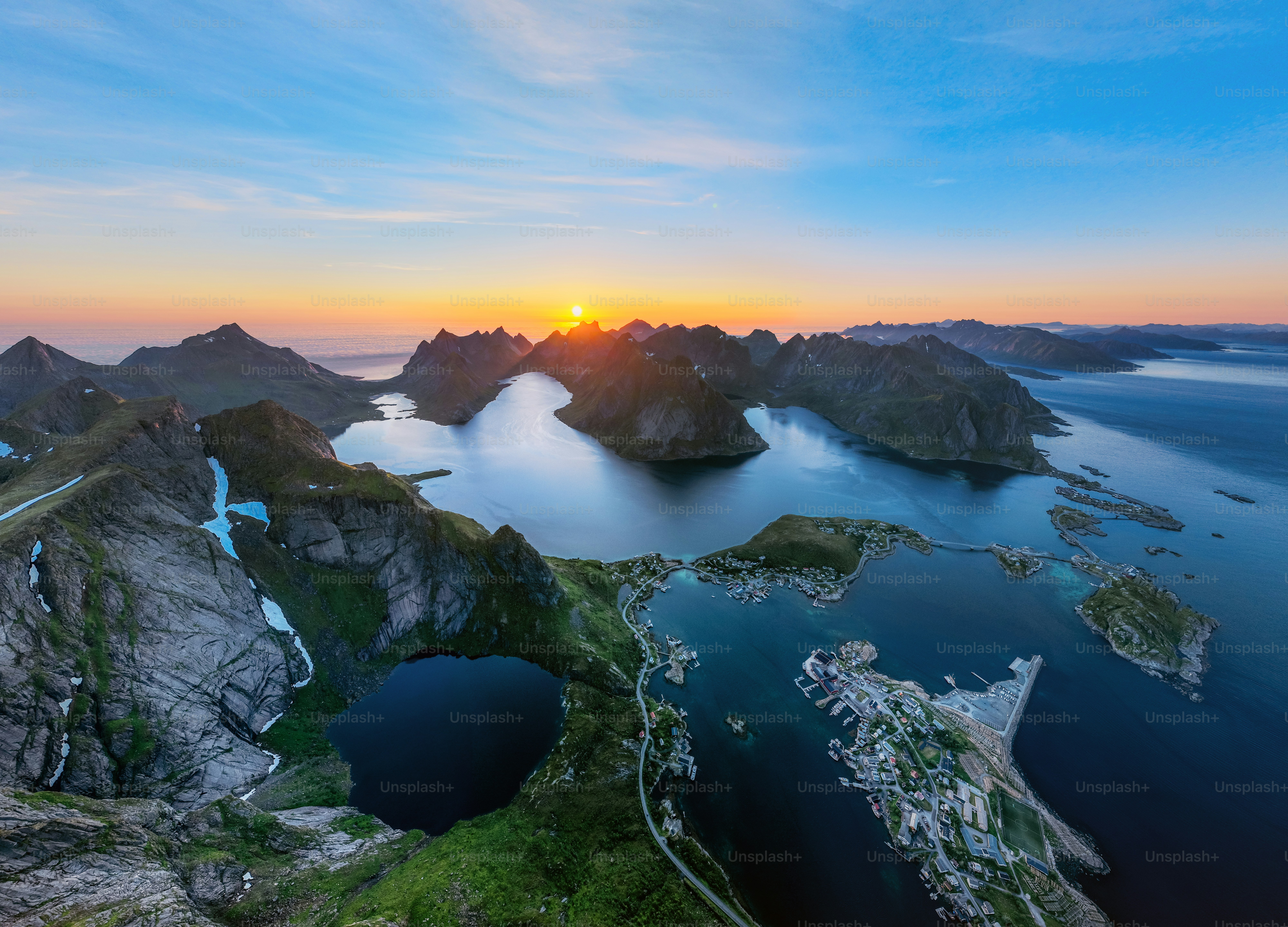 Dramatic sunset over rugged norwegian fjords and lakes.