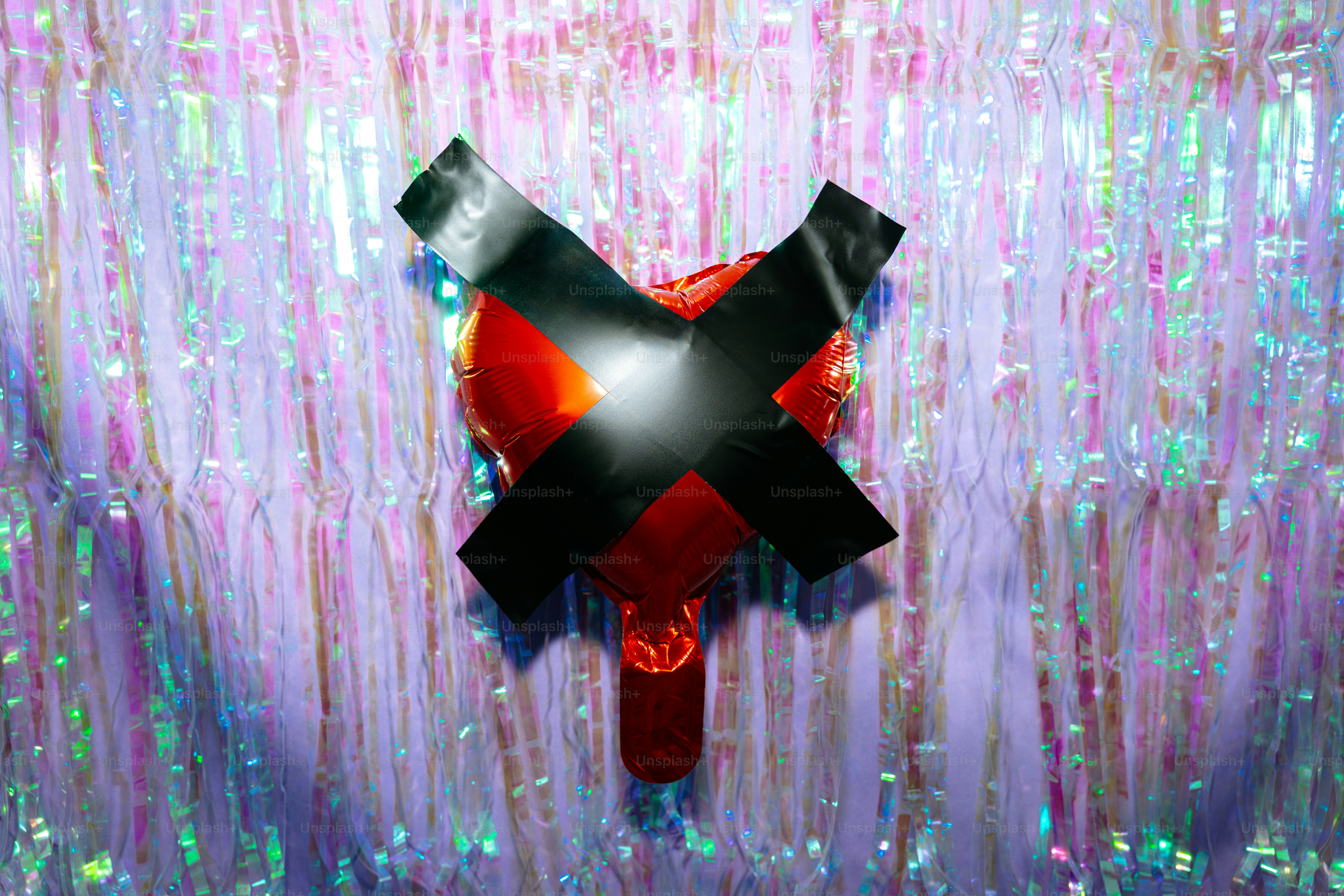 Red heart taped with black duct tape