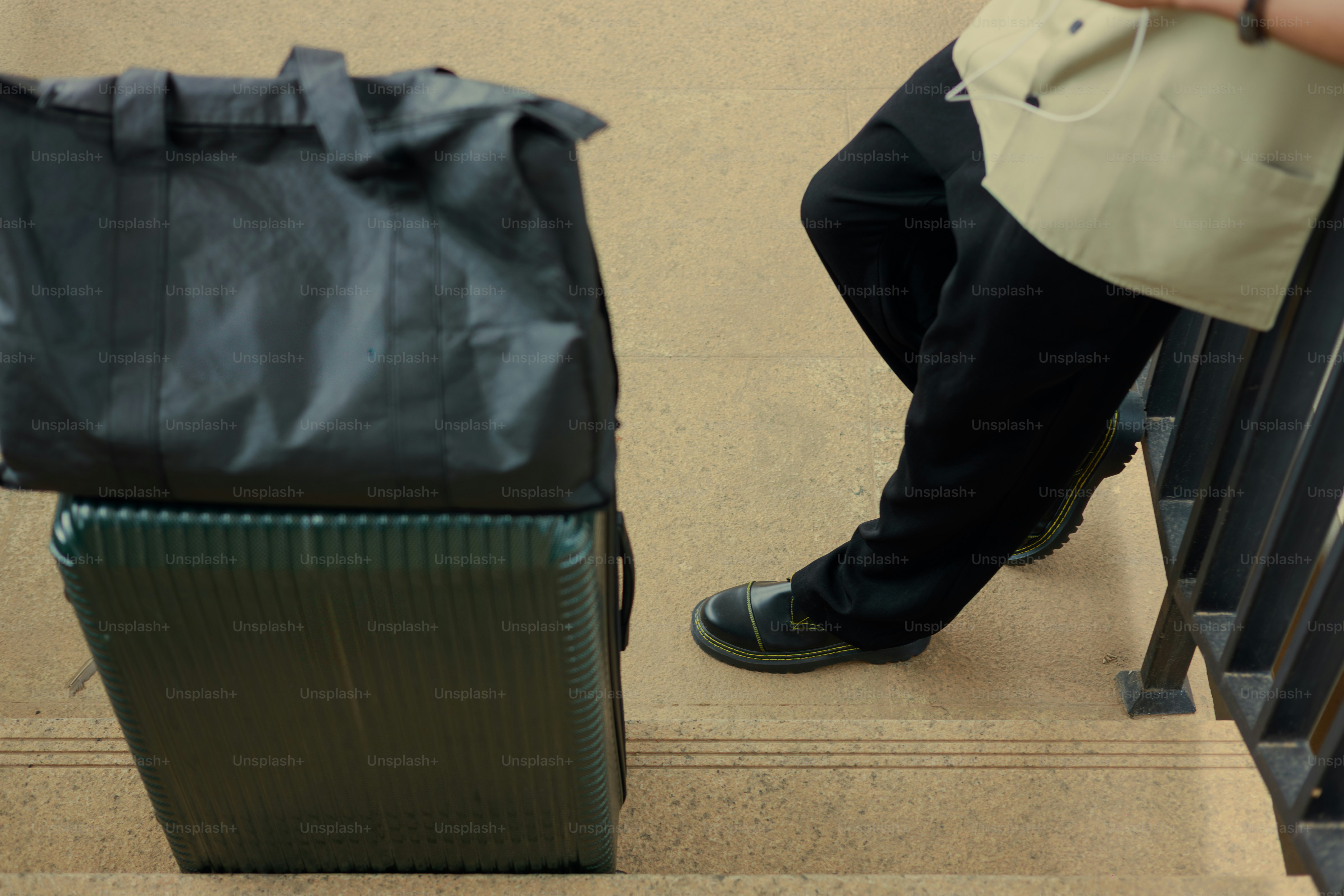 Person with luggage on stairs