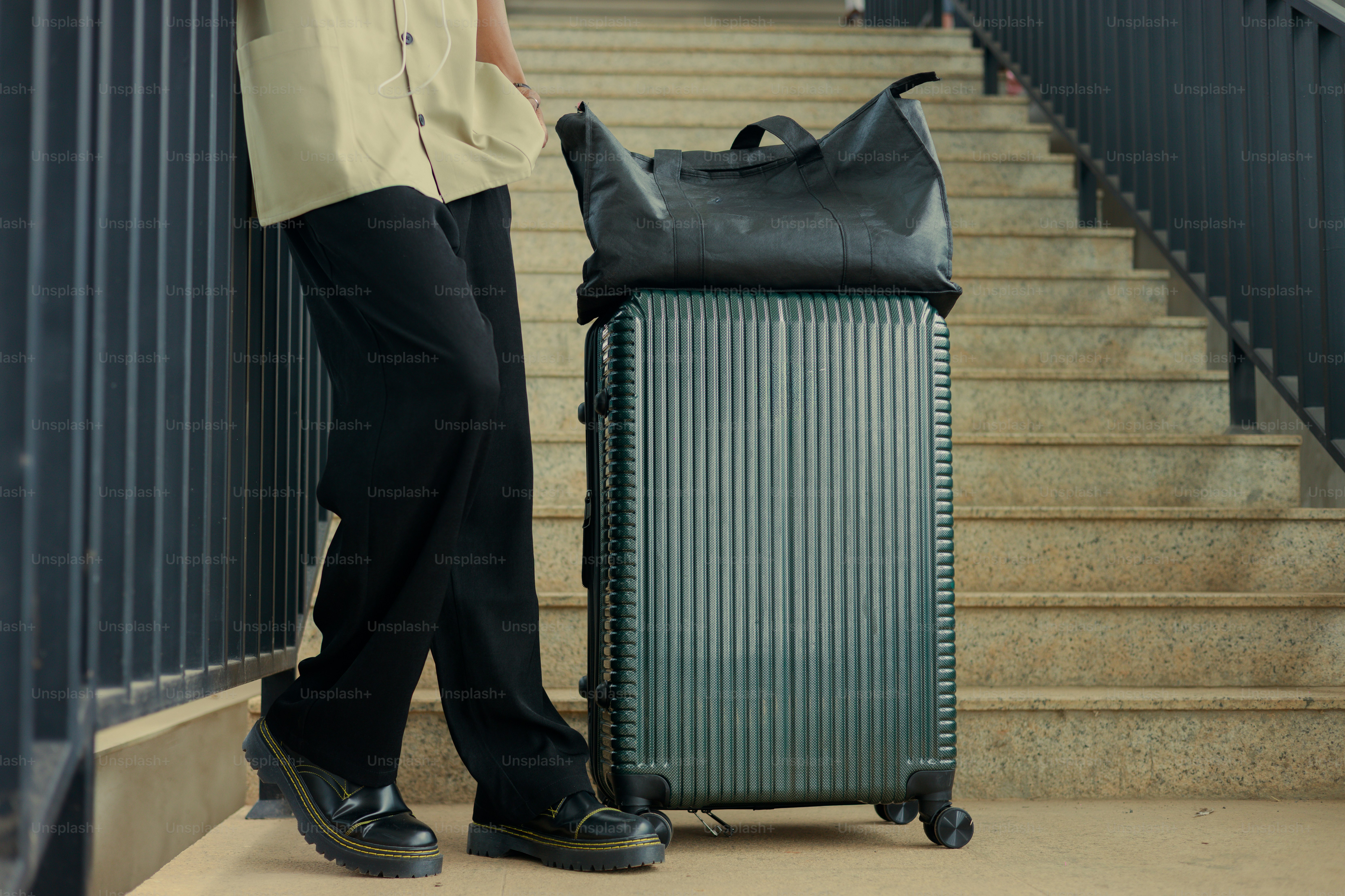 Person with luggage on stairs