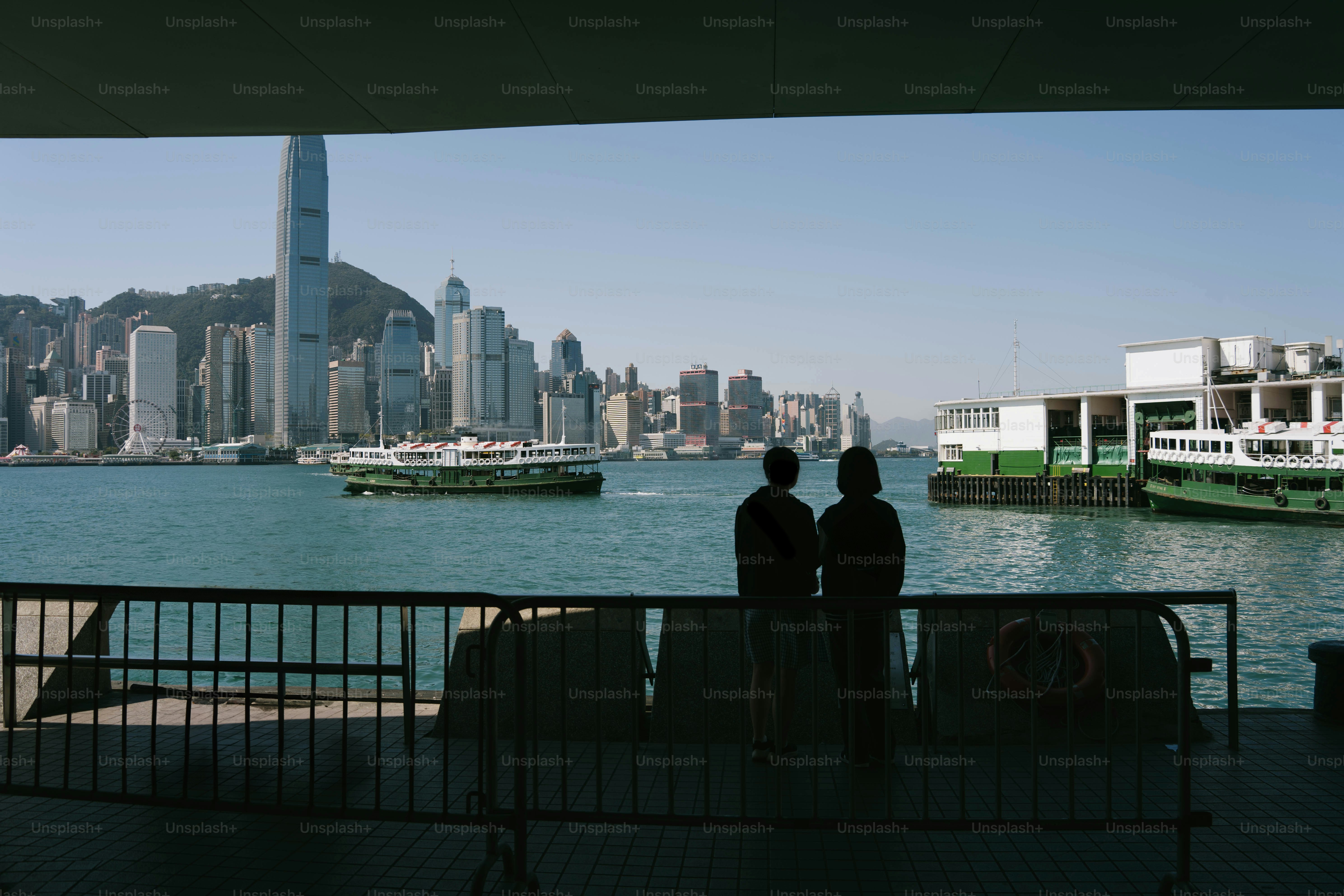 Runners waiting inside Staten Island Ferry terminal using subway marathon guide routes