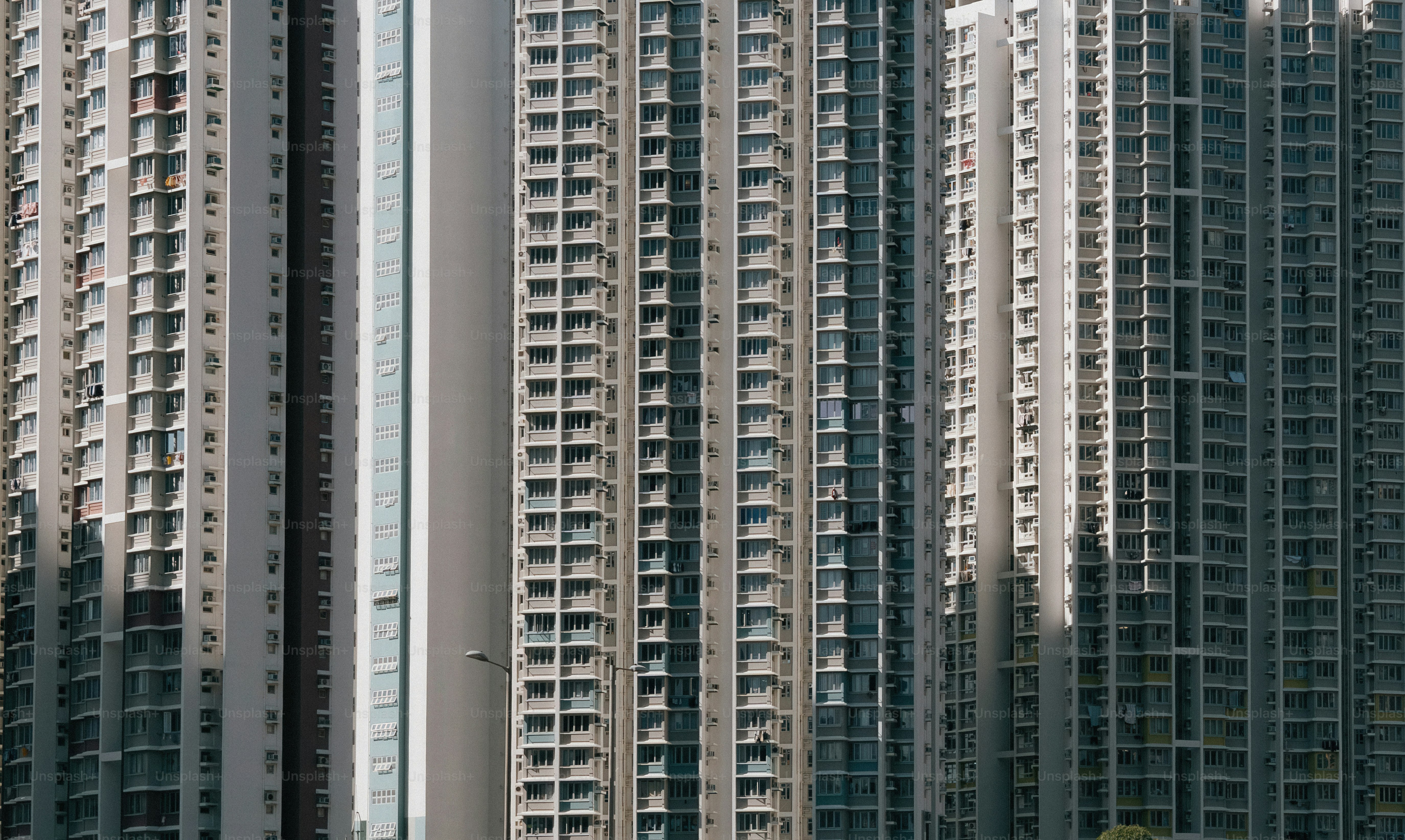 Numerous identical apartment buildings stand tall. photo – Wallpaper ...