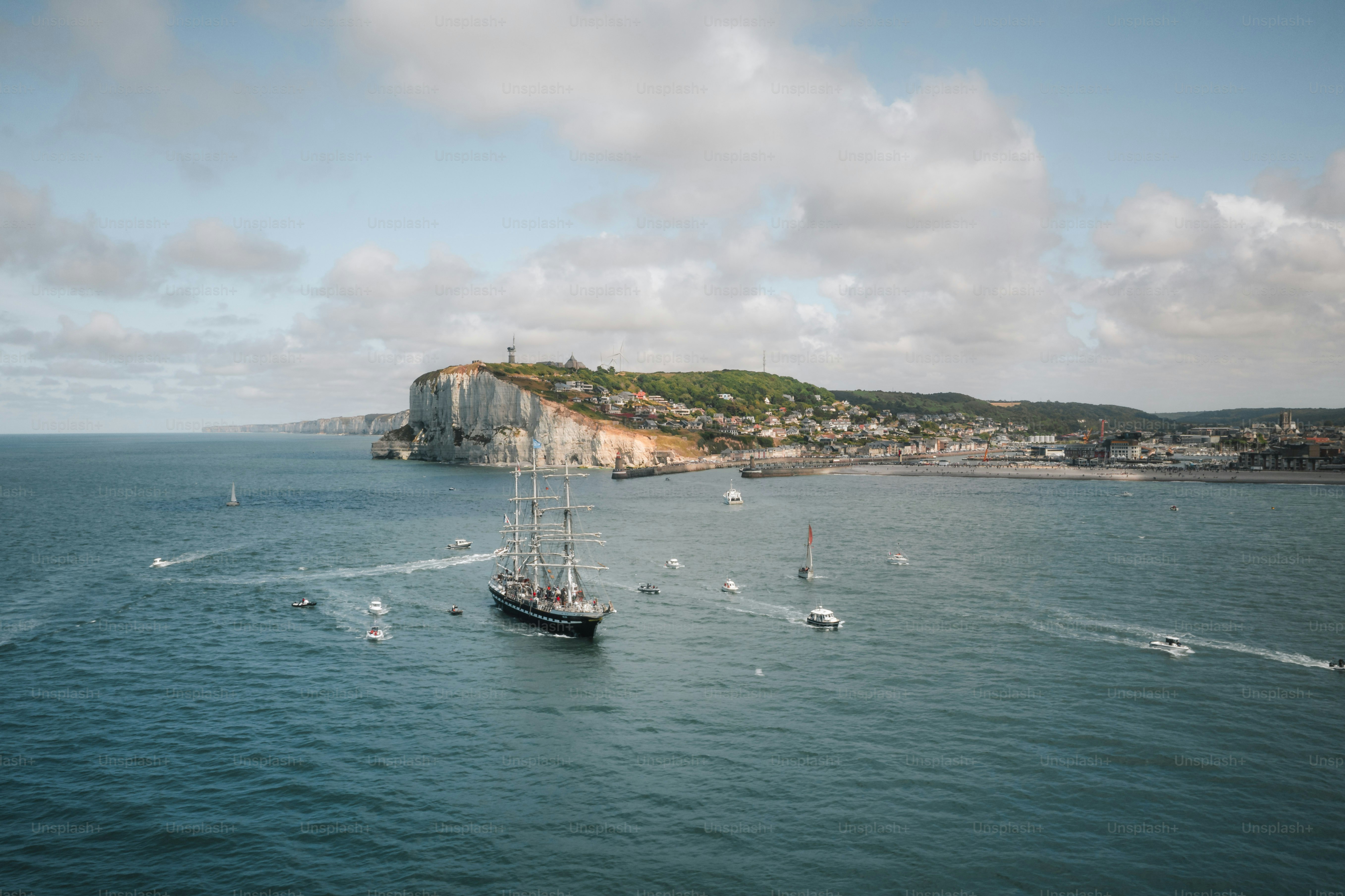 Tall ship sailing on the sea near coast
