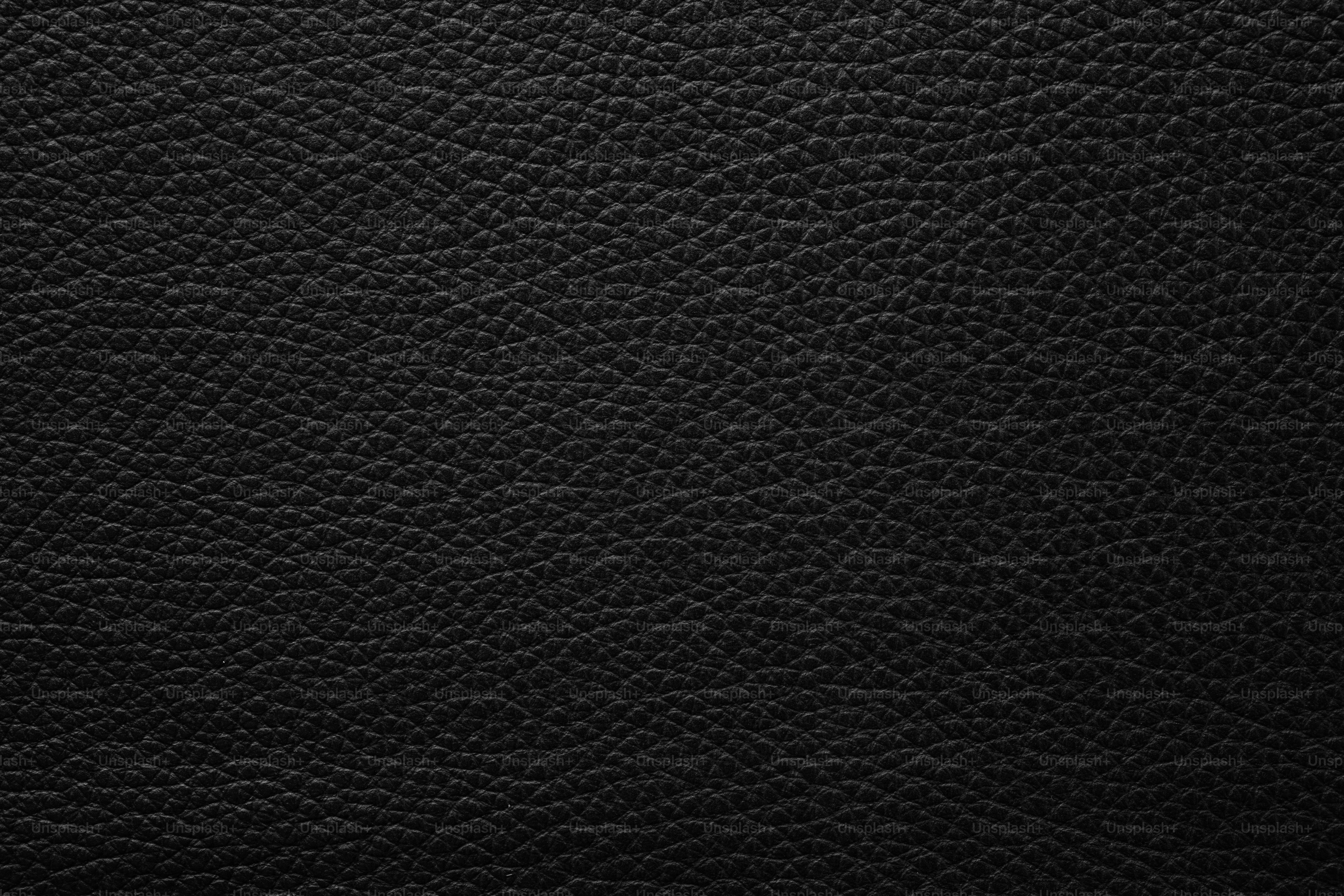 texture de cuir noir avec de véritables rides, fond abstrait de luxe