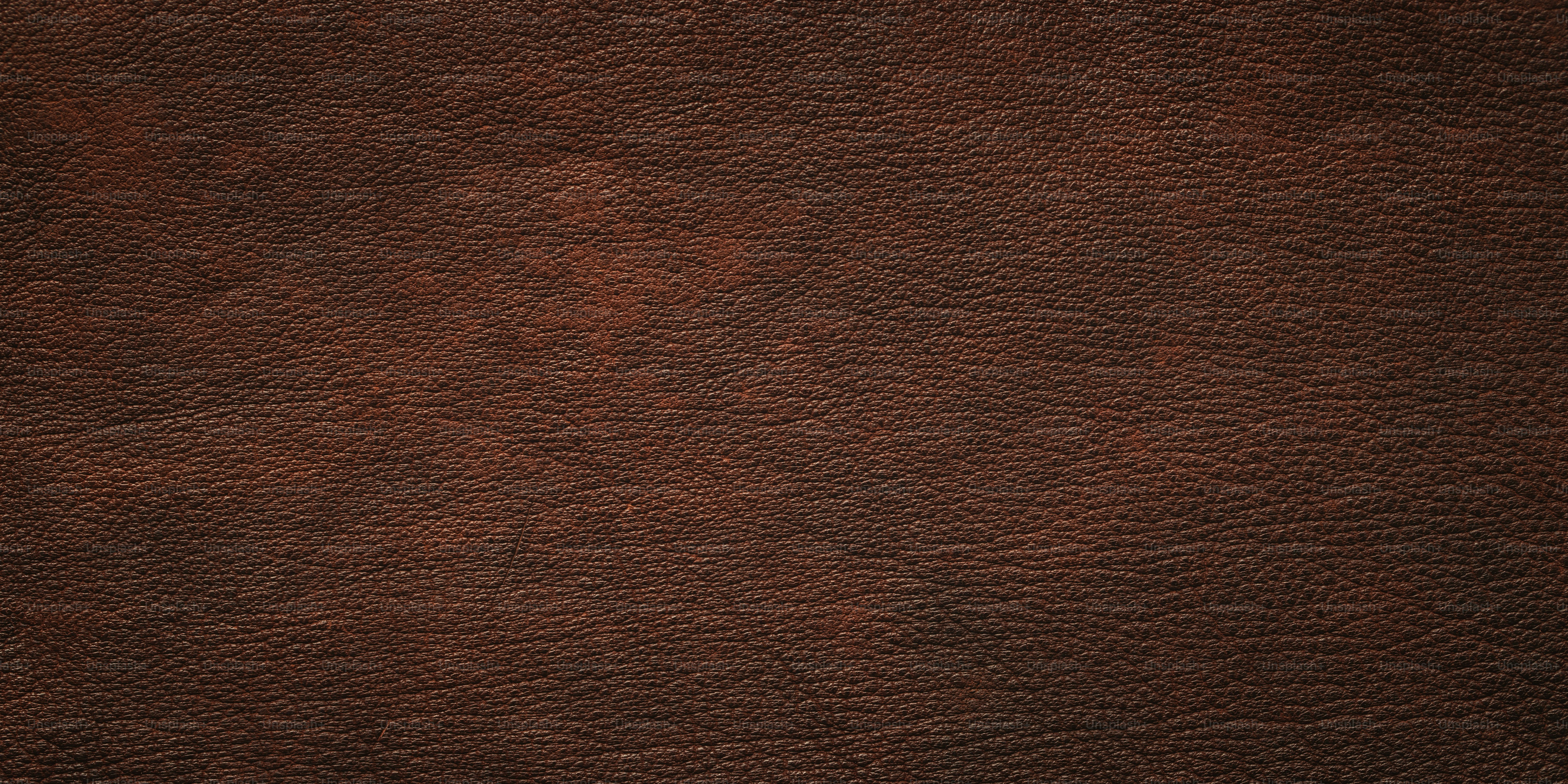 brown leather texture as background. natural cowhide close-up