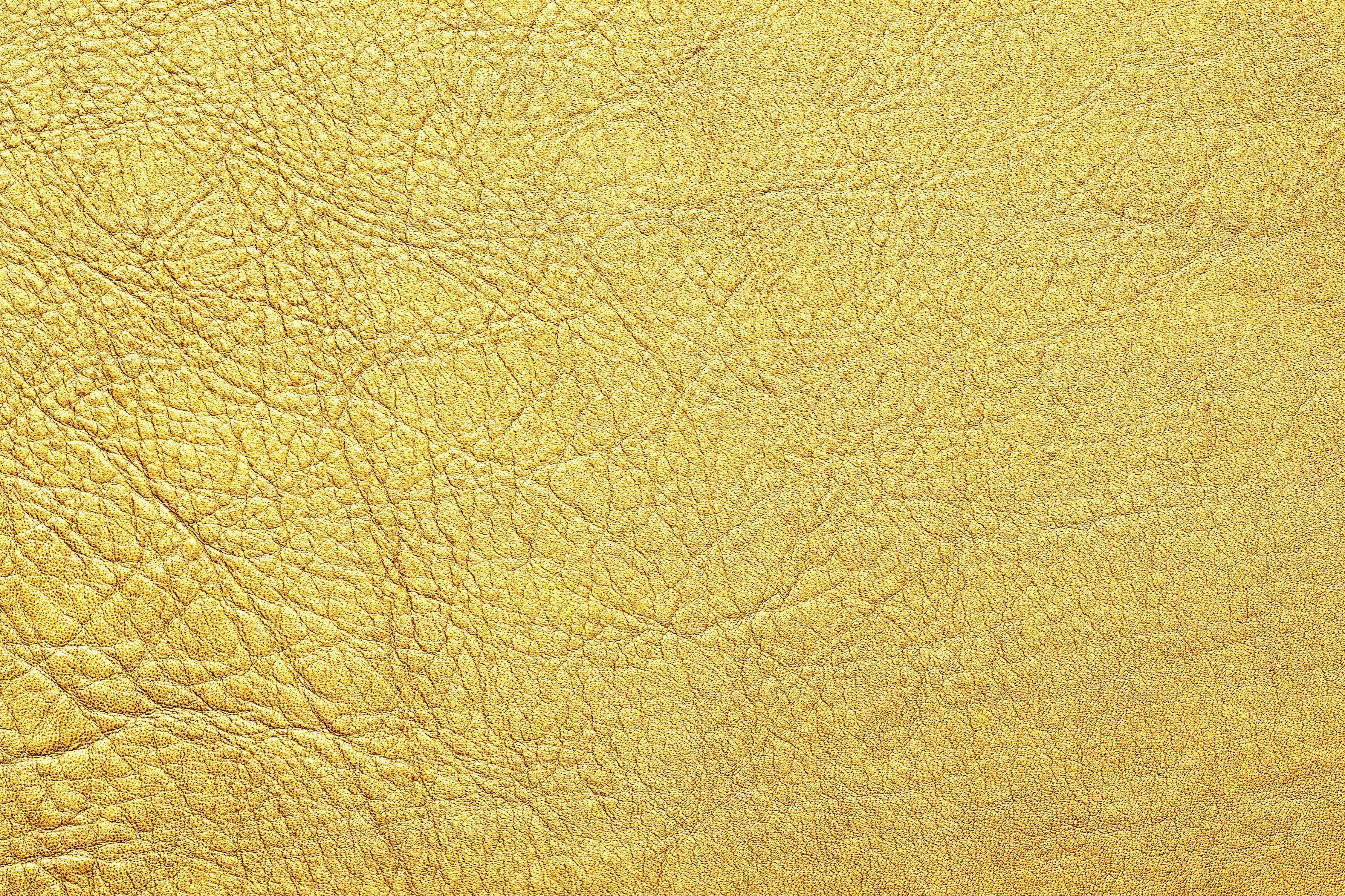 golden background, natural leather texture with shiny surface