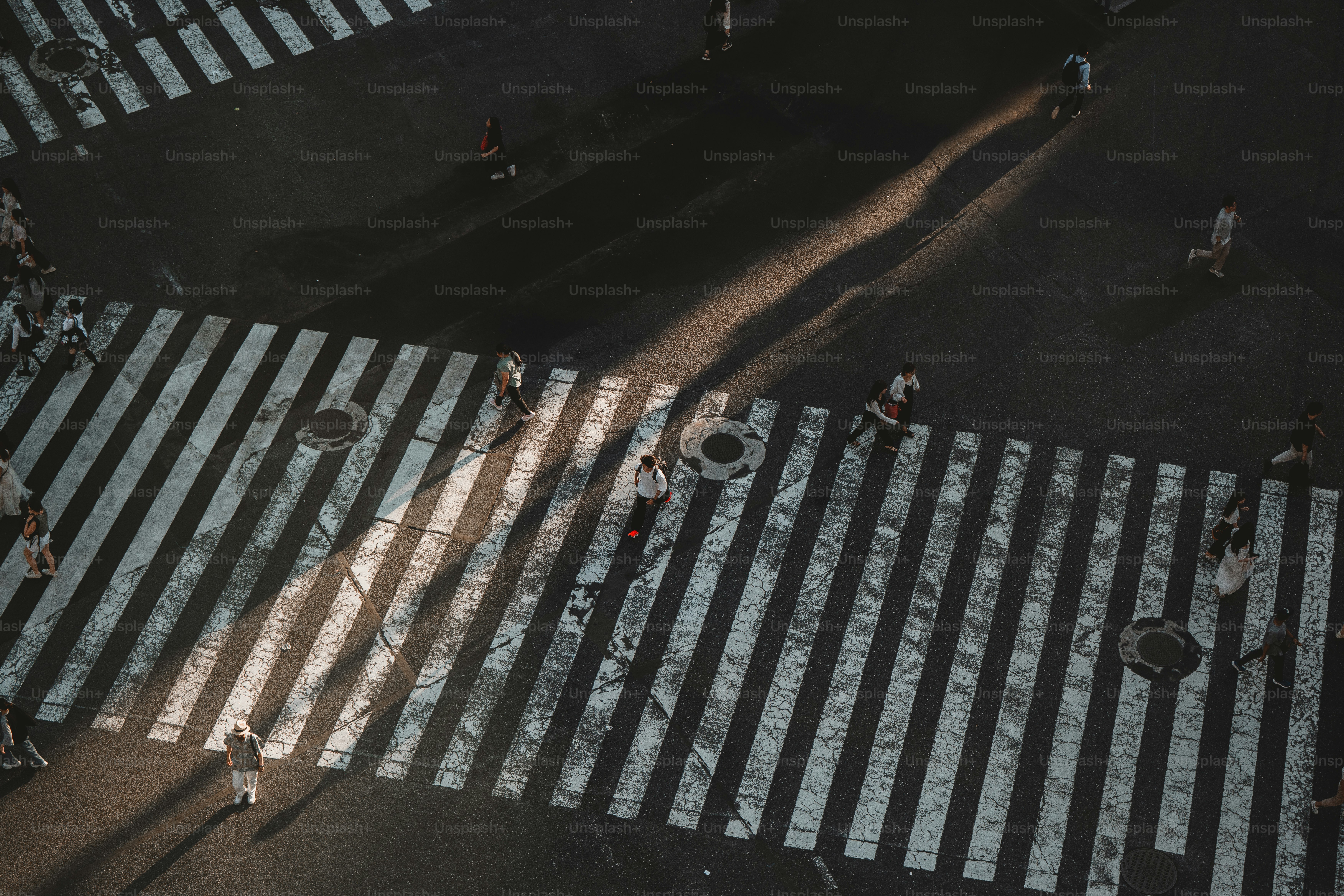 People crossing a street at a crosswalk