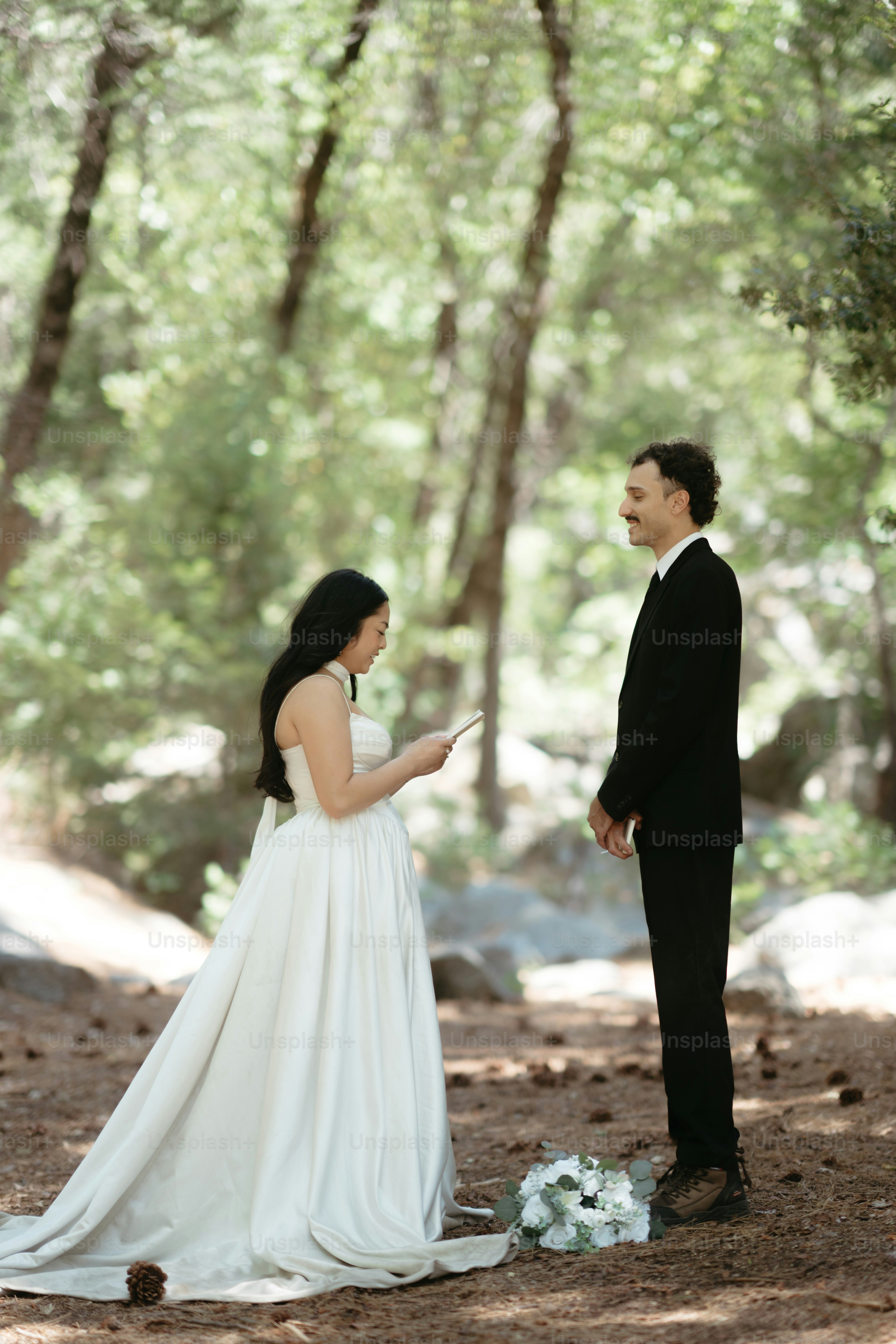 Couple exchanging vows in a forest setting