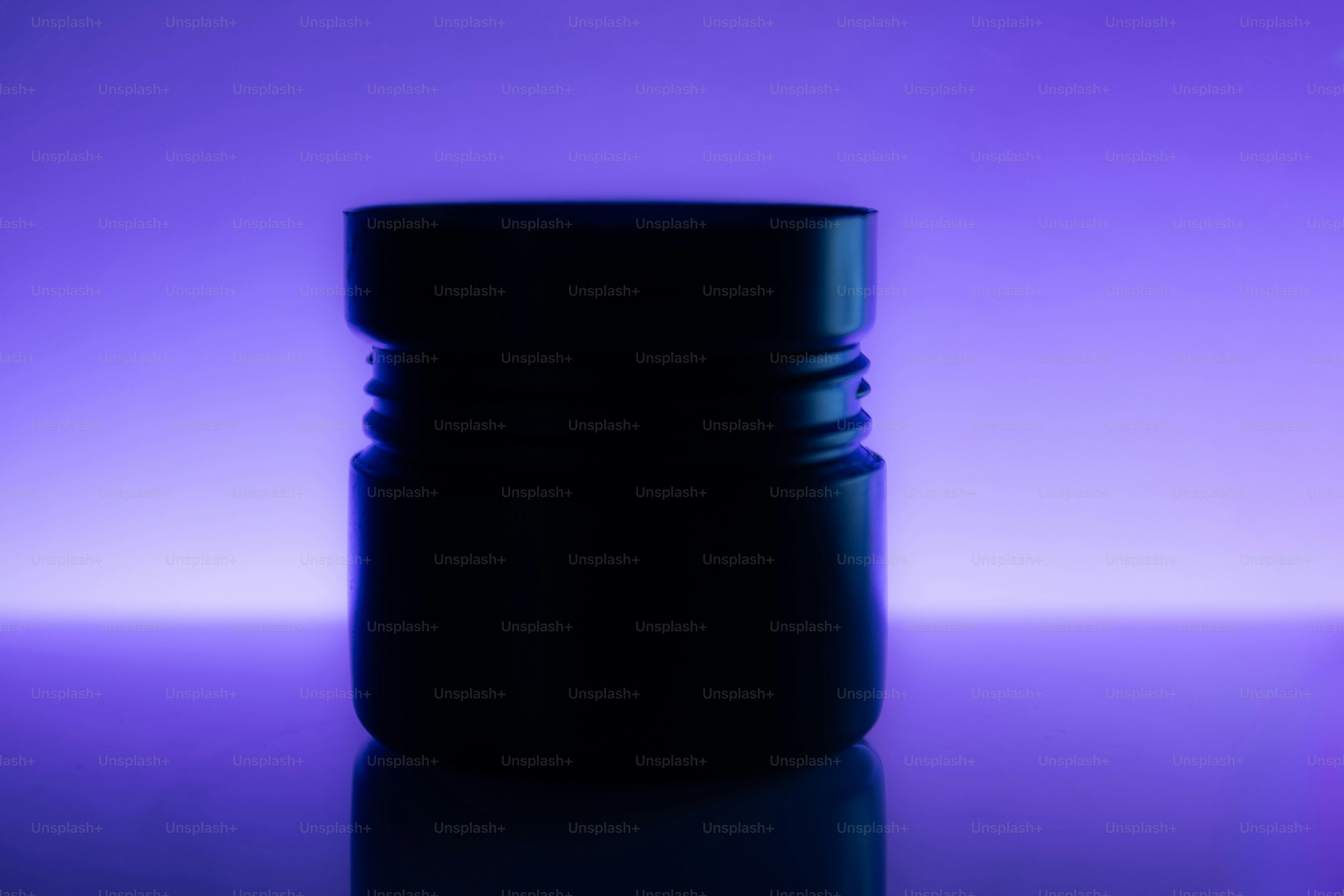 A dark cylindrical object with ribbed sides. photo – Minimalist Image ...