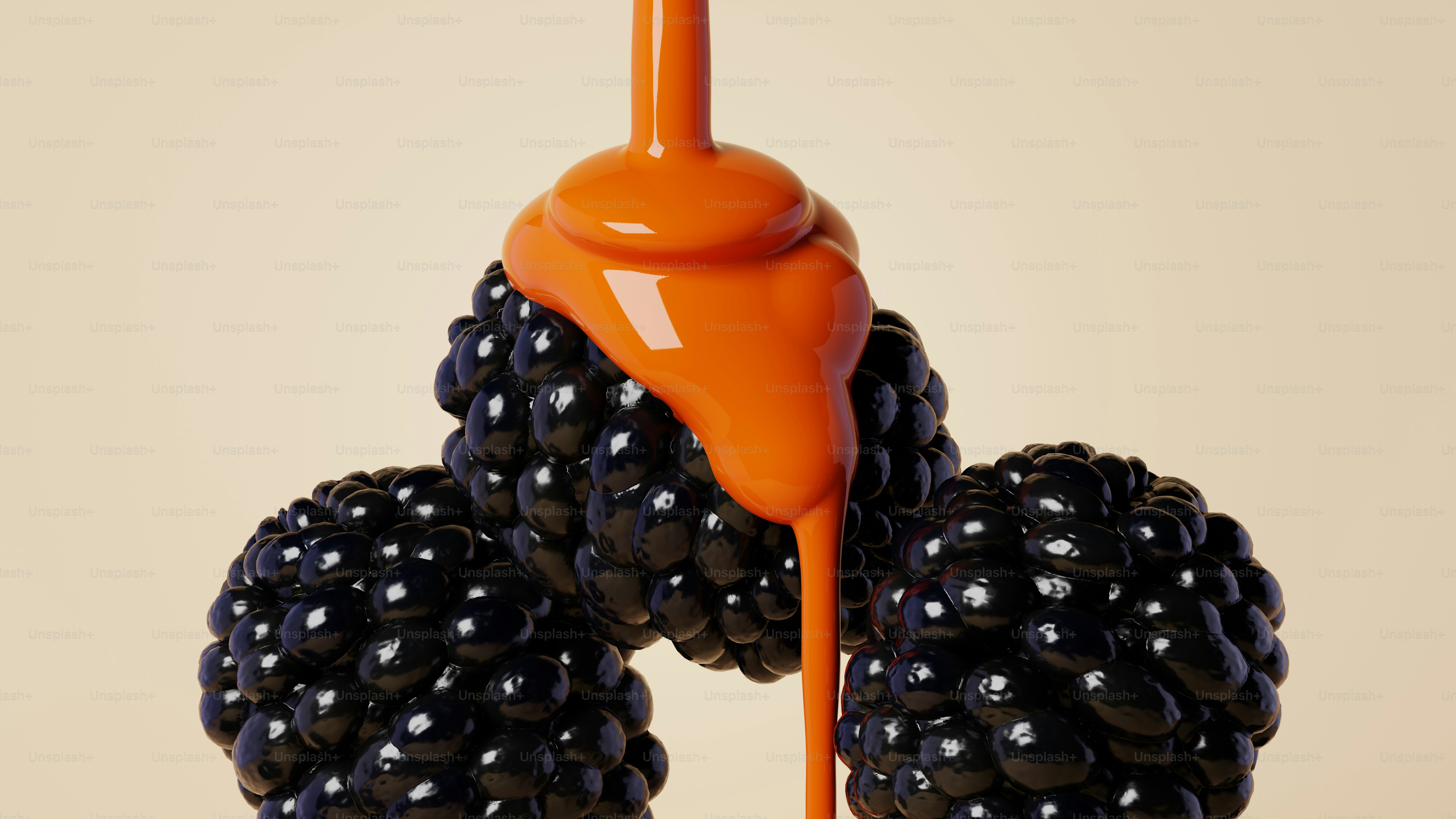 Orange sauce being poured over fresh blackberries.