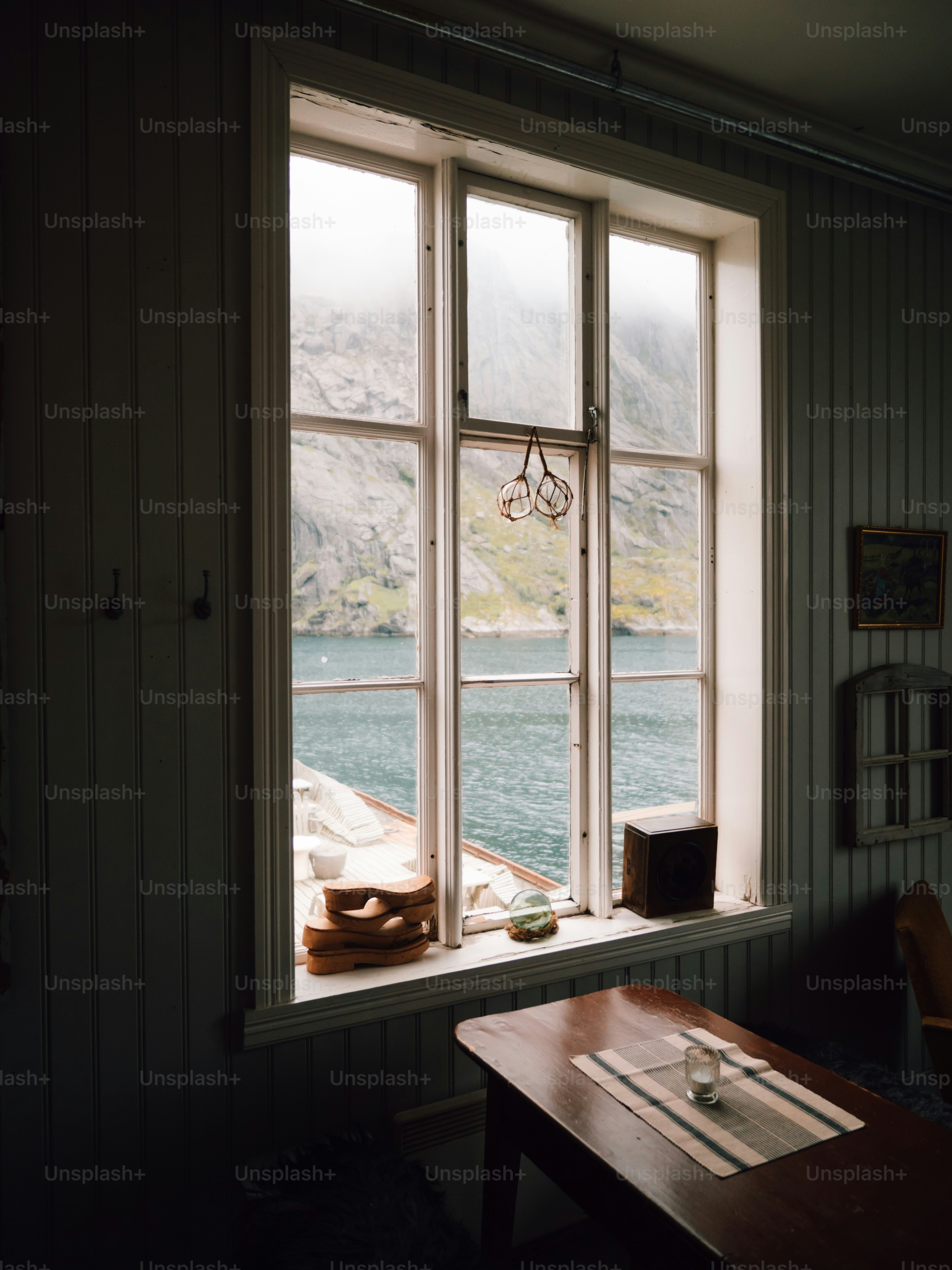 View of a fjord through a rustic window photo – Travel Image on Unsplash