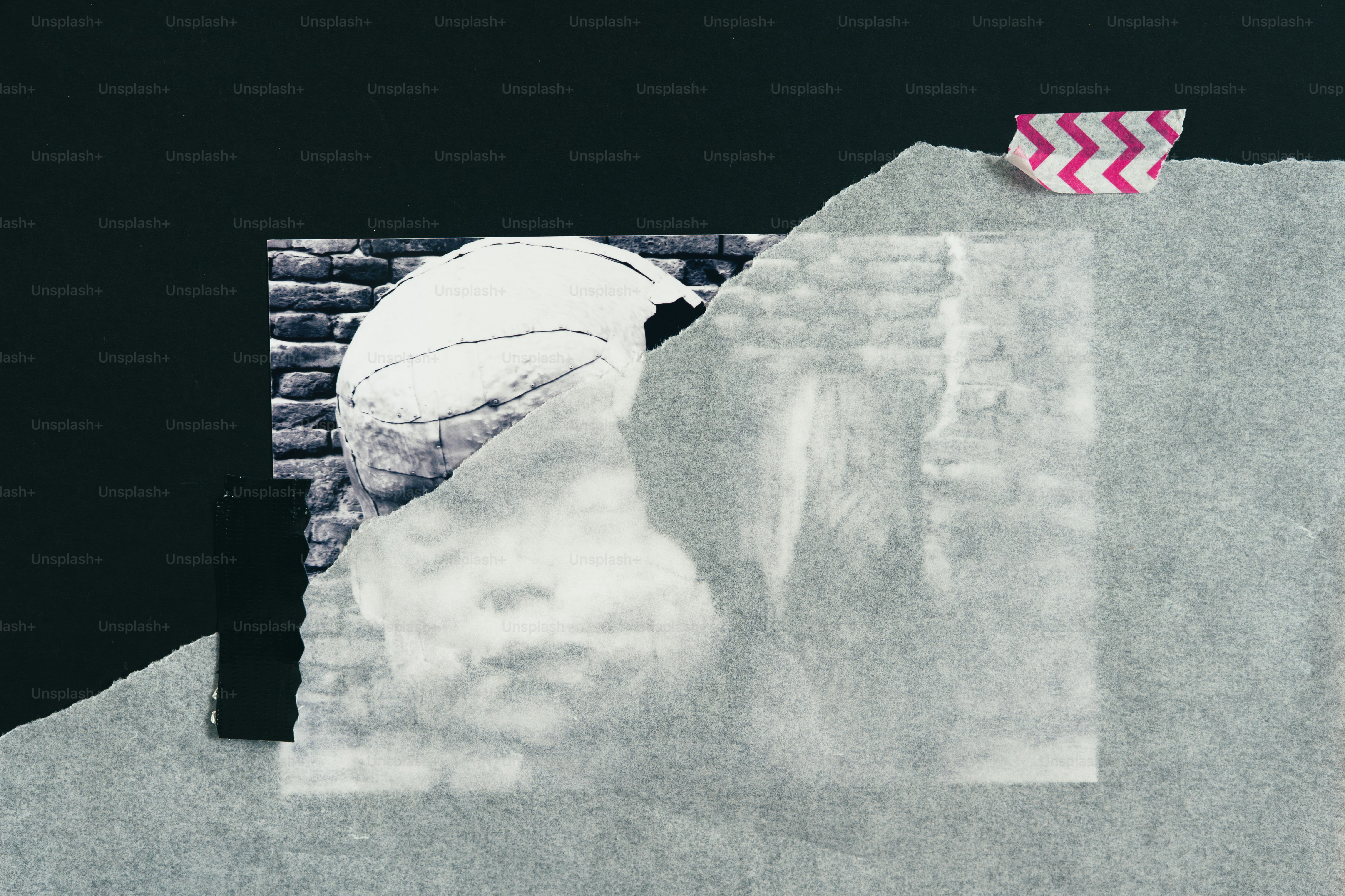 Collage of textured papers and black and white elements.