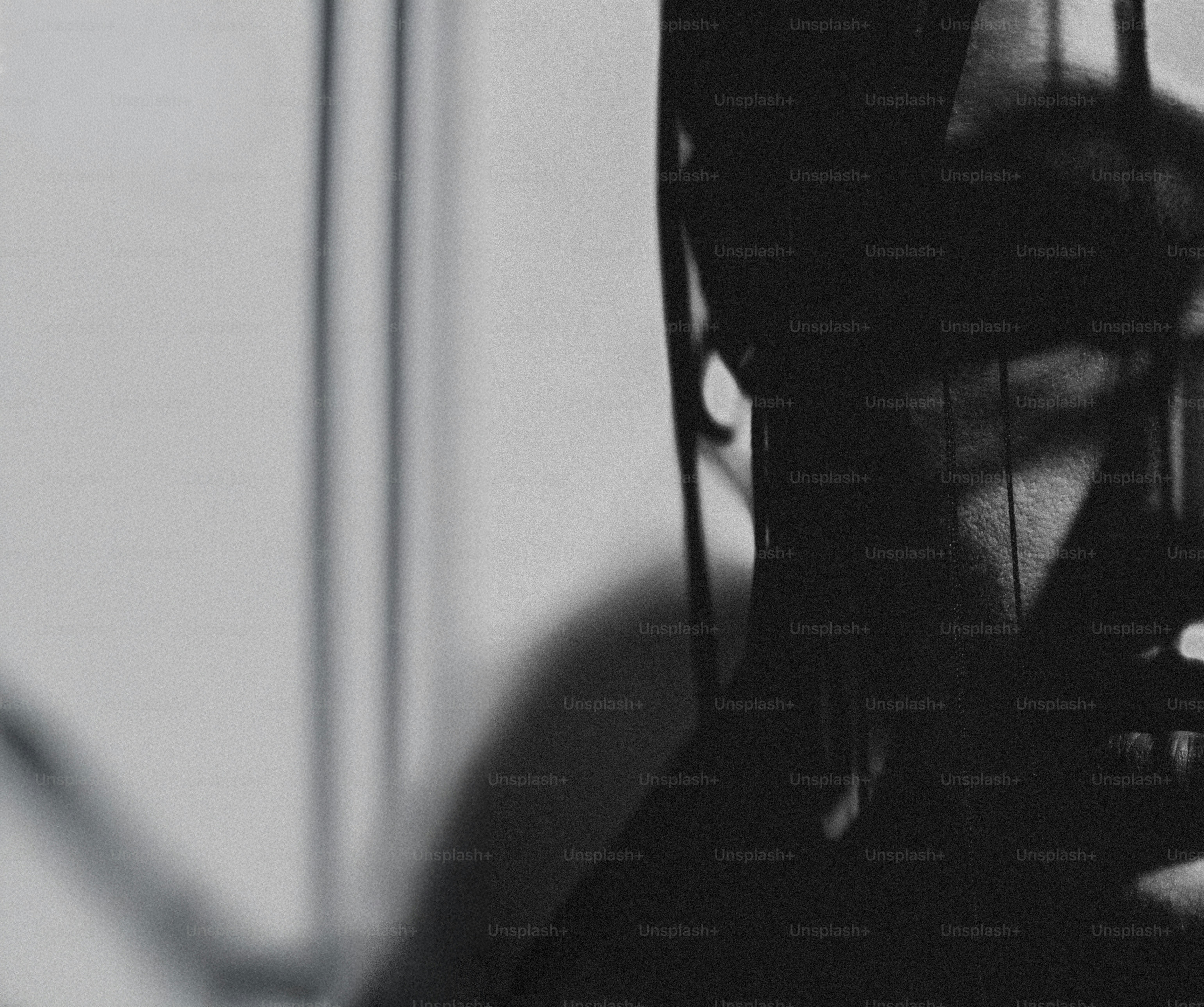 Shadows cast on a wall by window blinds