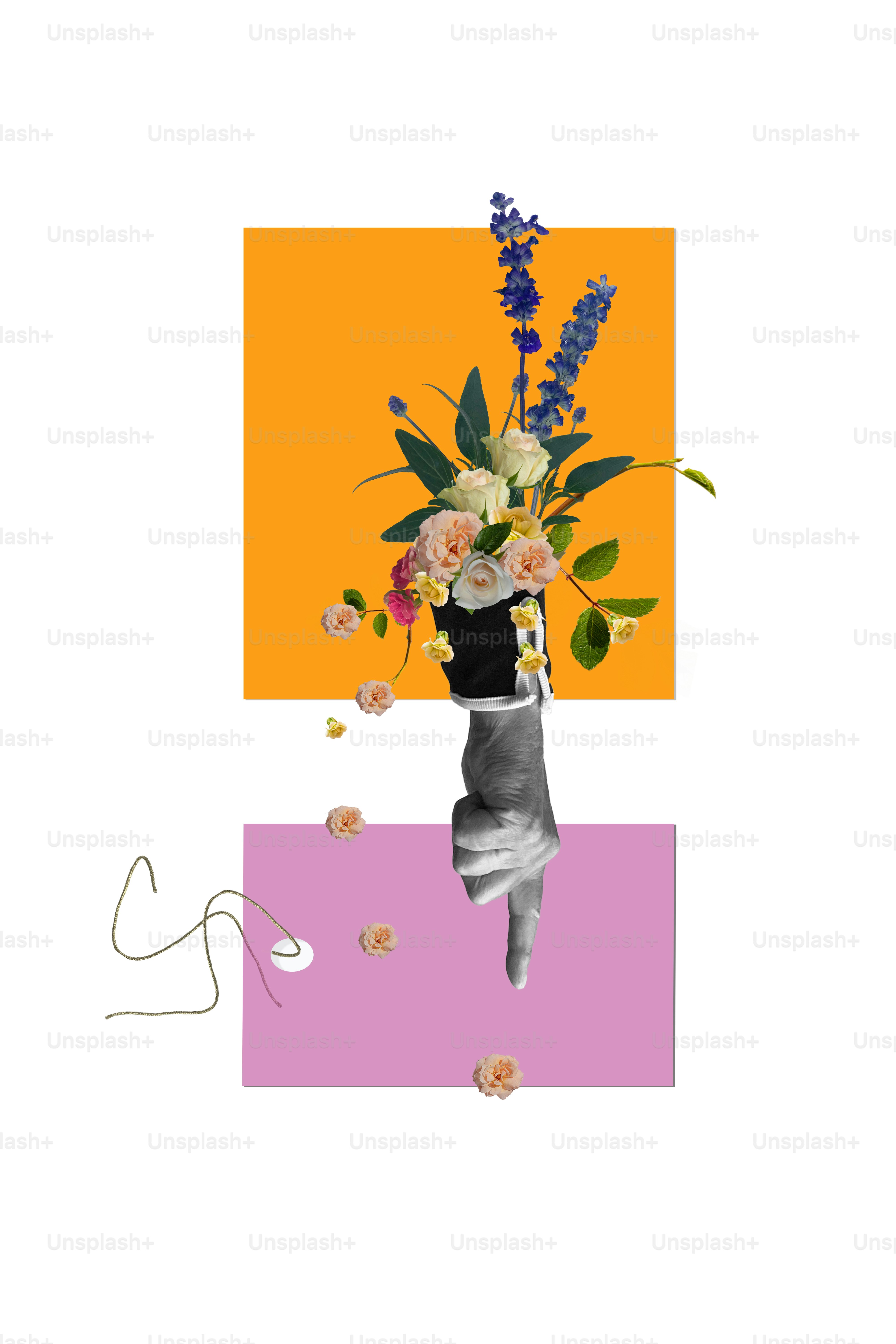 Mano sosteniendo flores contra formas geométricas