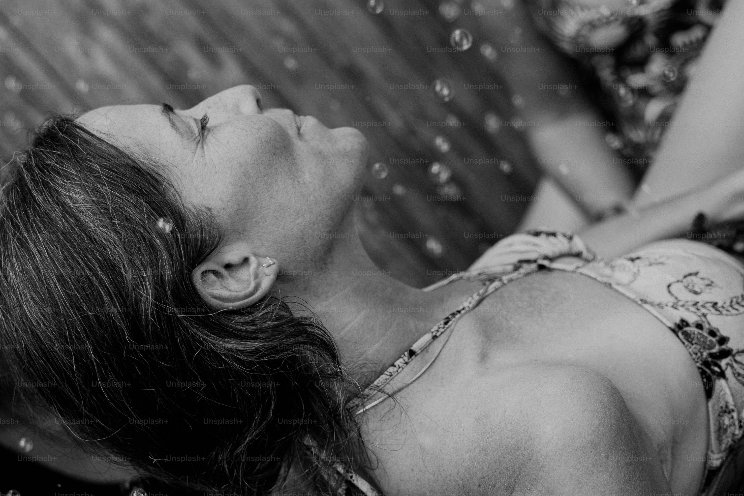 Woman looking up with bubbles around her