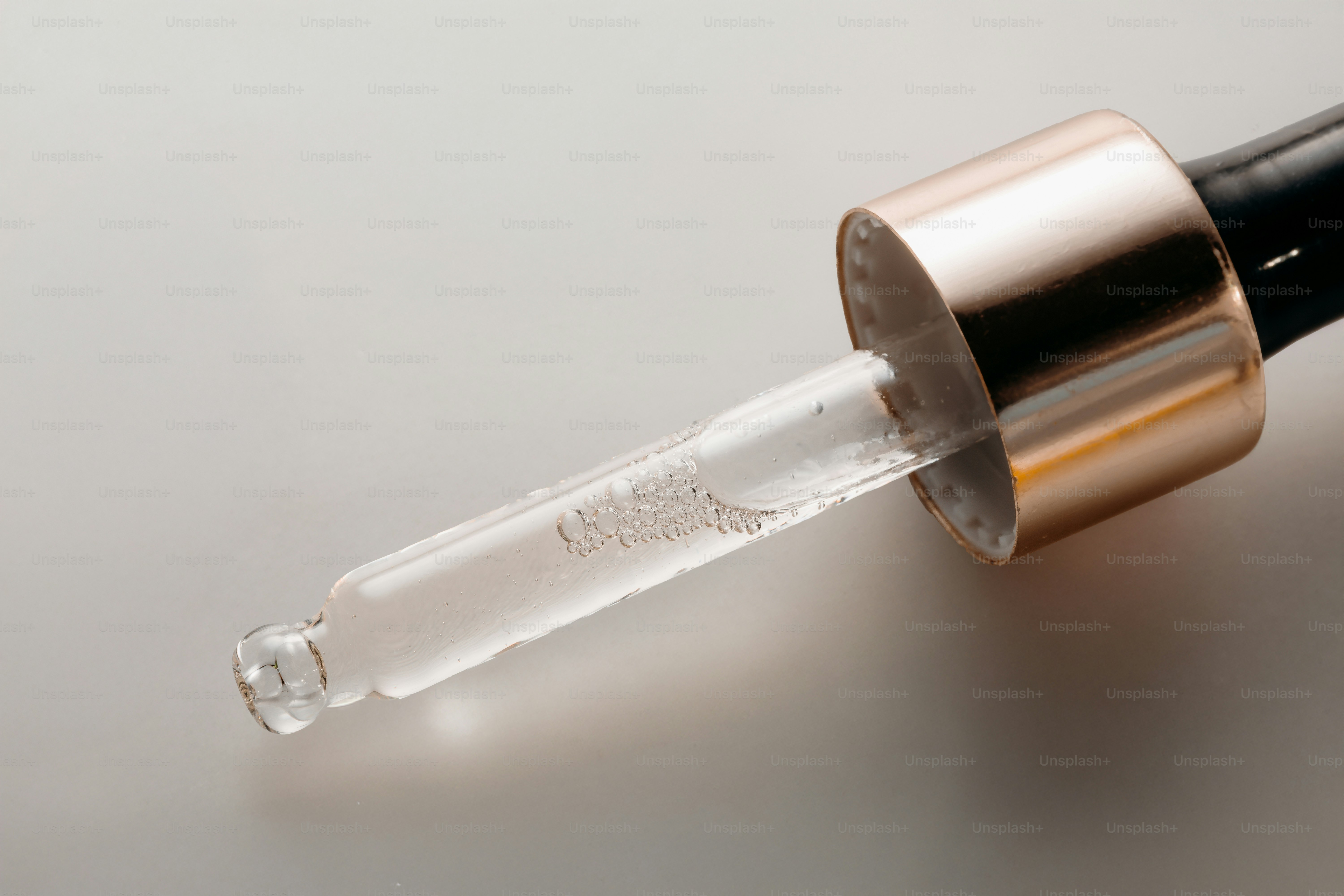Close-up of a dropper with clear liquid photo – Green Image on Unsplash