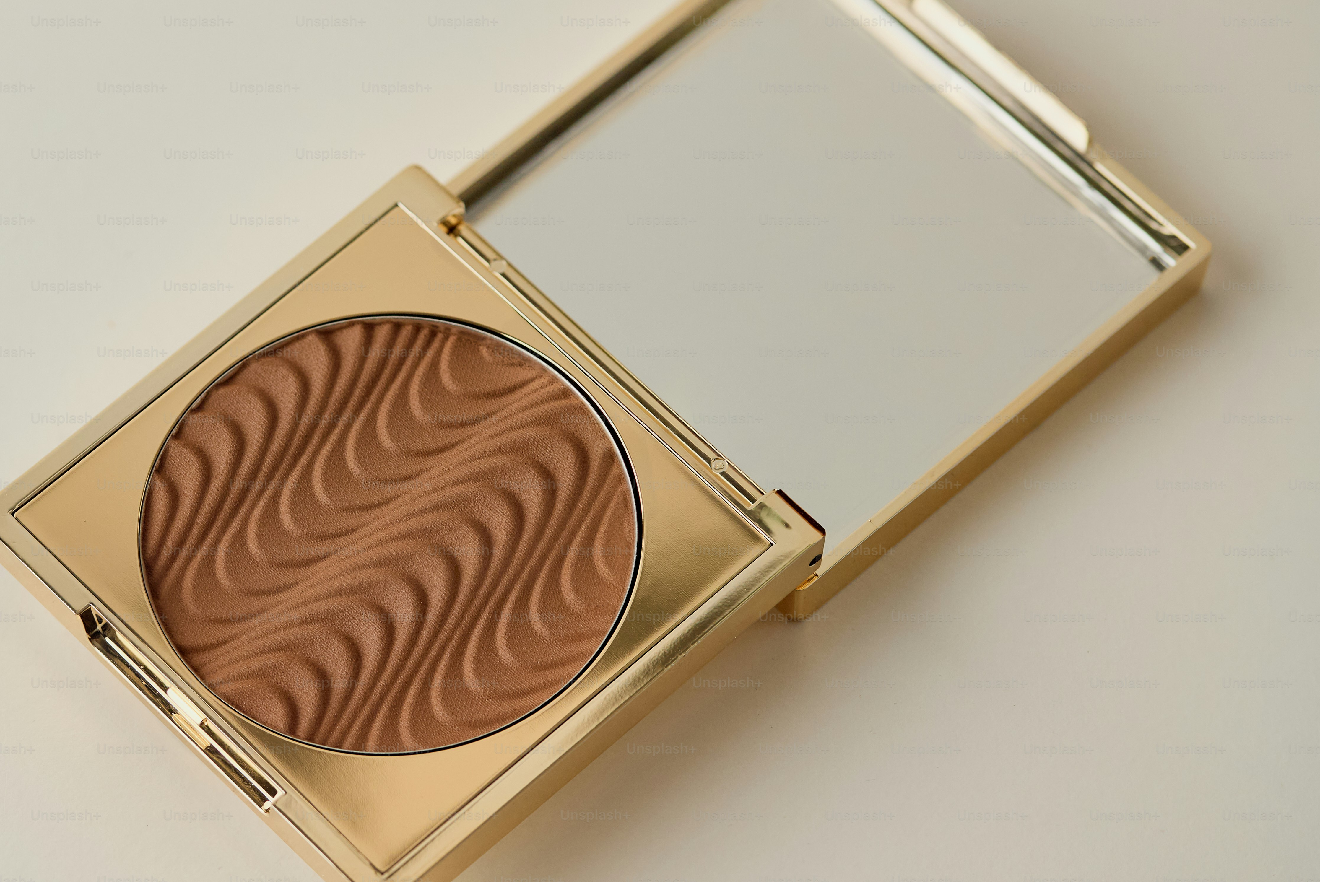 A bronzer compact with wavy texture