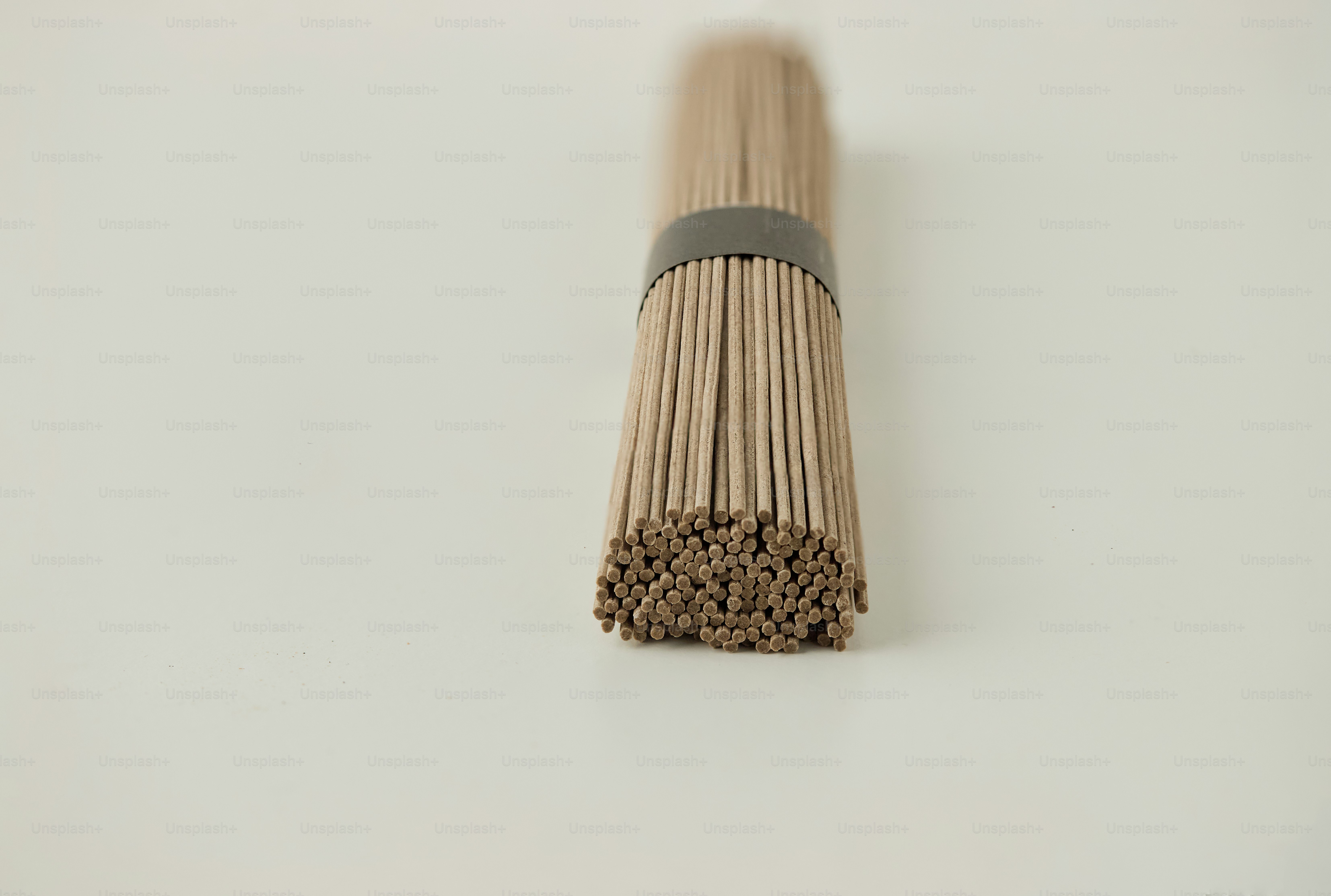 Bundle of uncooked soba noodles tied with a band