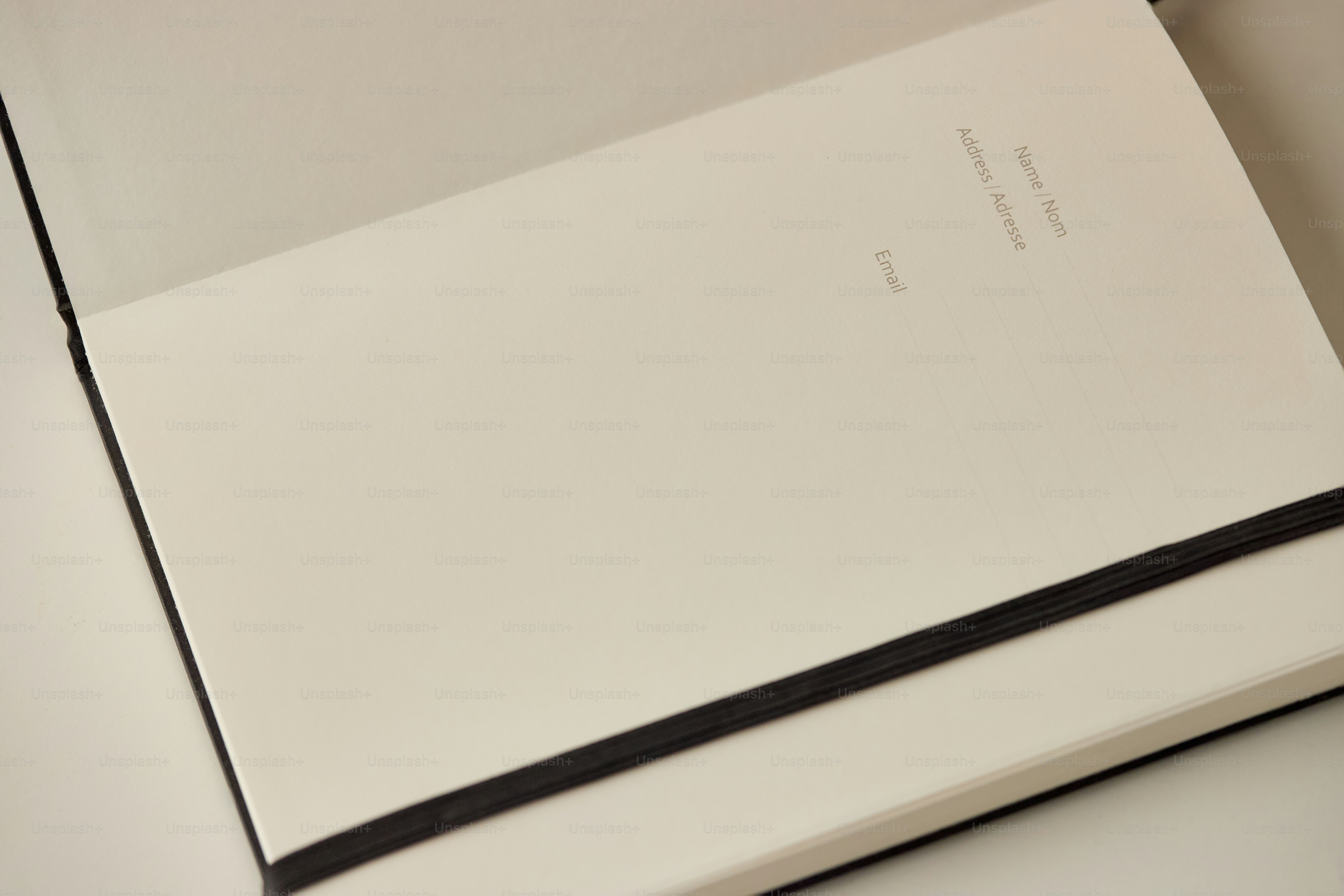 A blank notebook with a black elastic band.