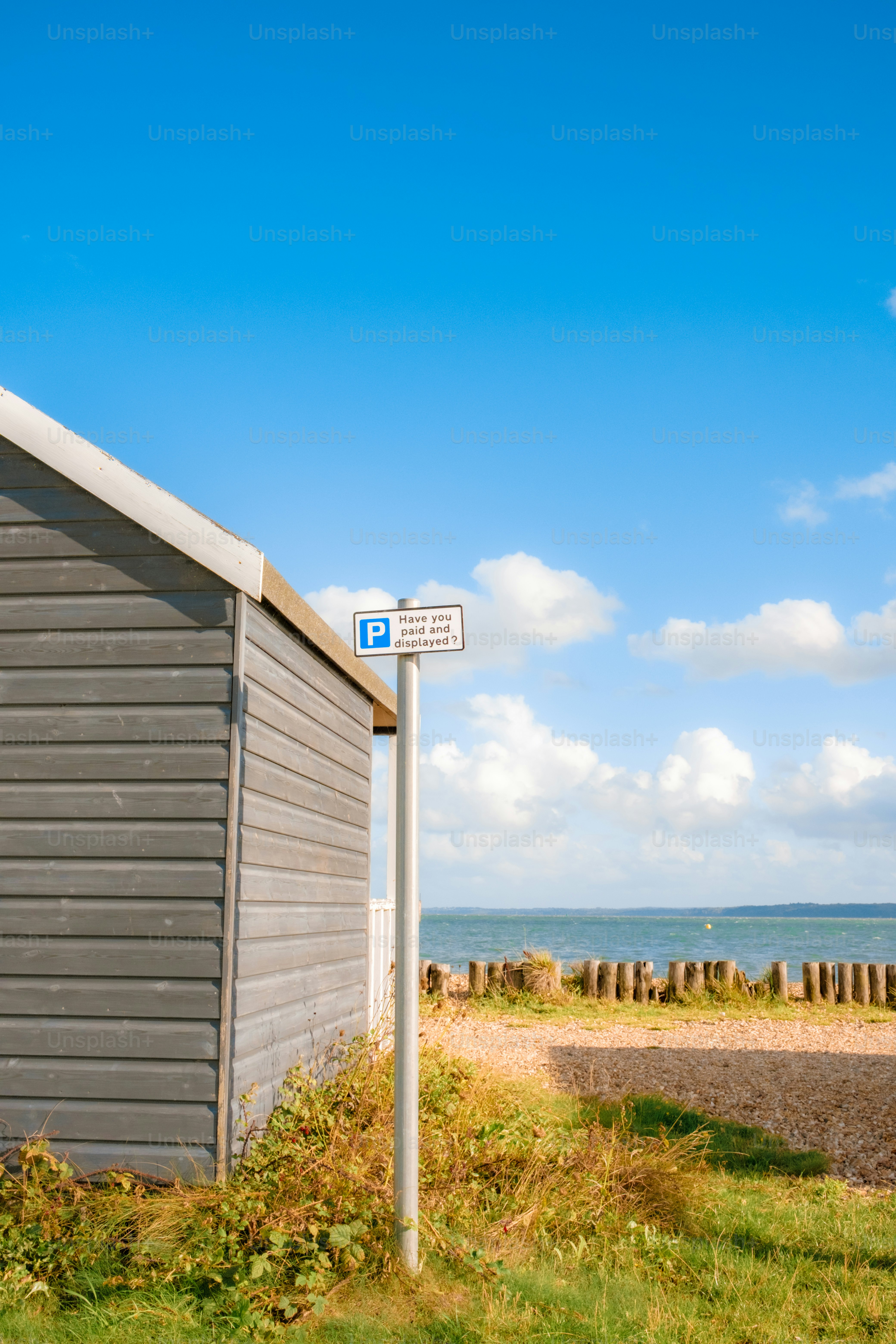 Light blue beach huts with pink stripe and number. photo – Beach Image ...
