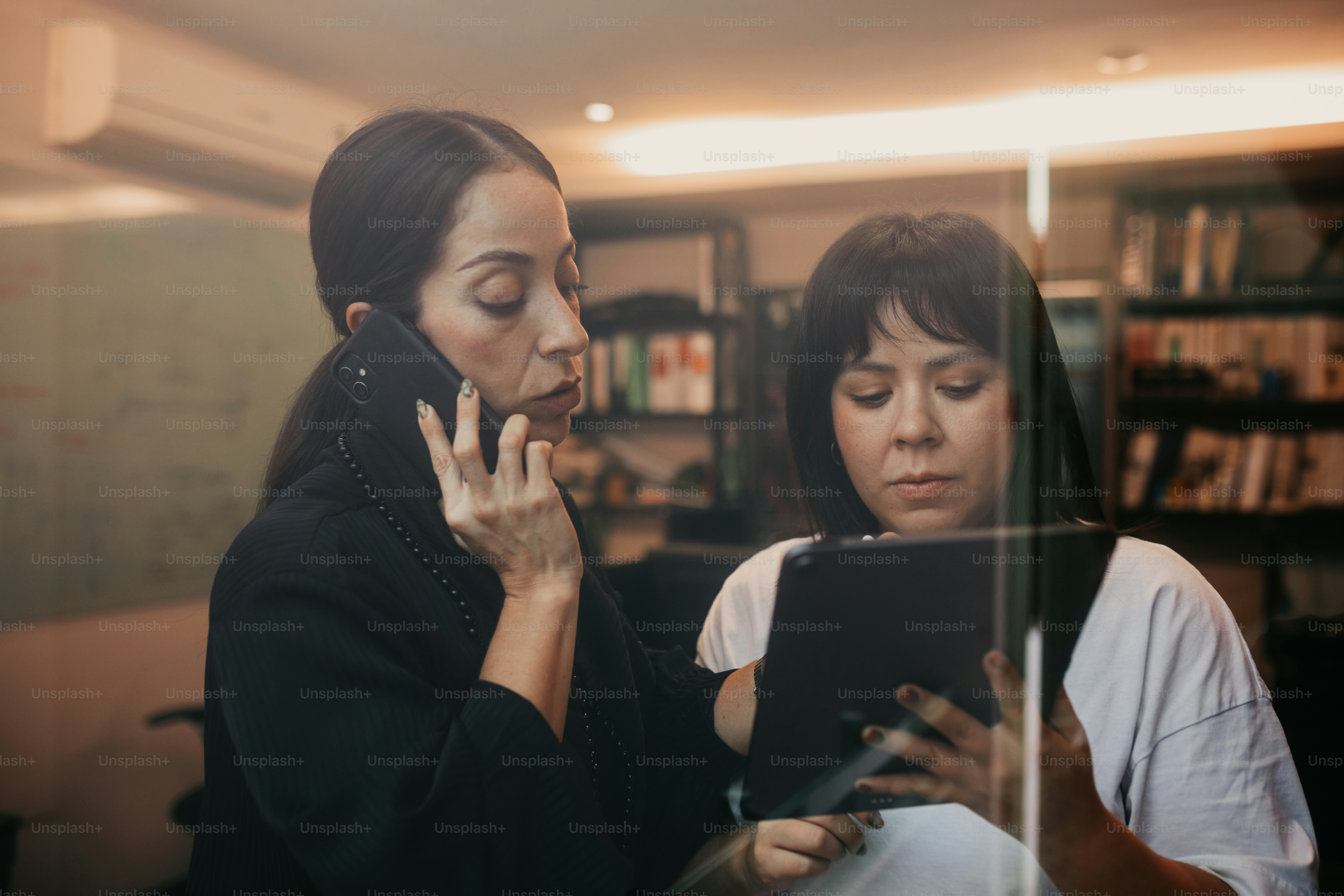Two women working together in an office setting