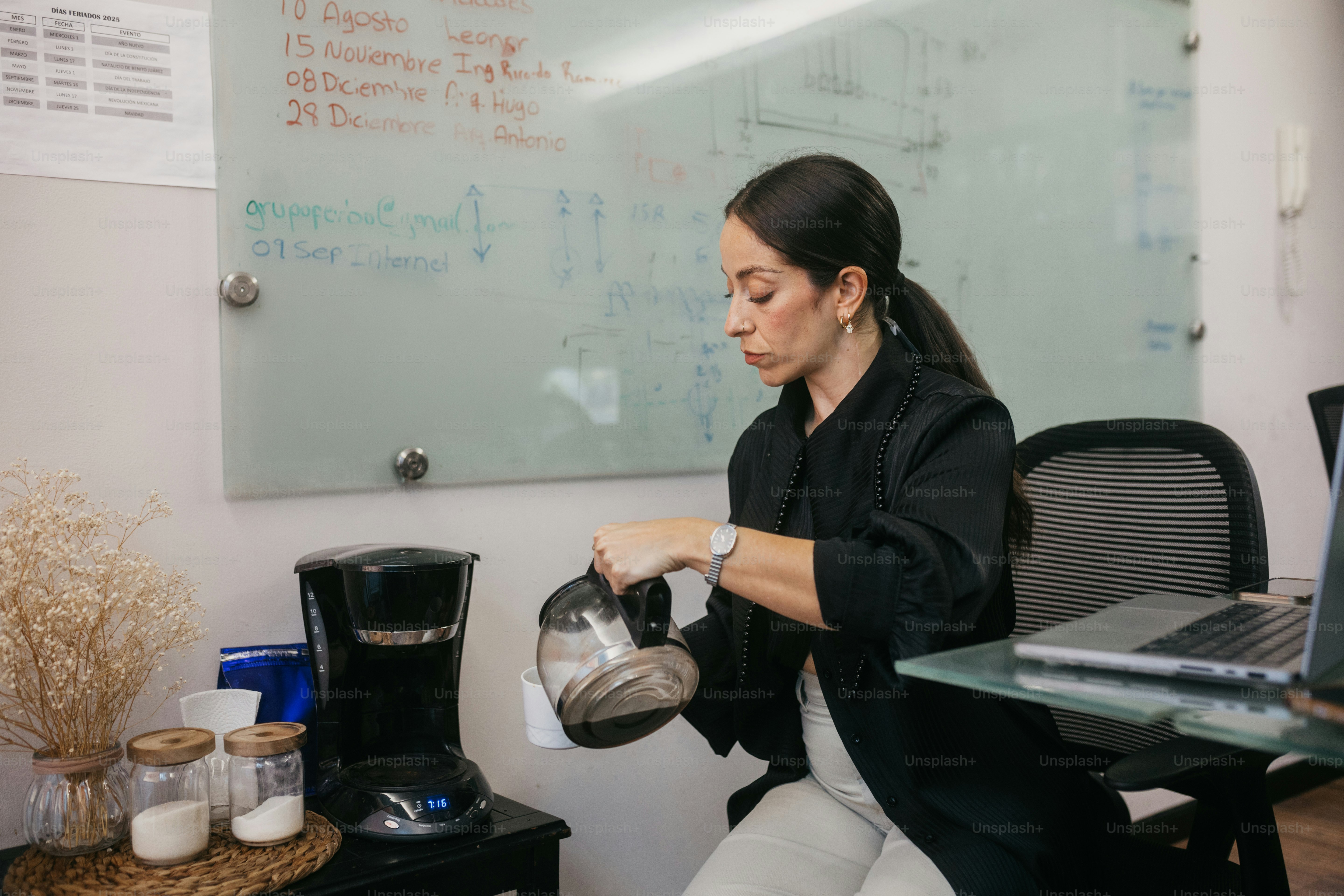 Woman pouring coffee from a coffee maker