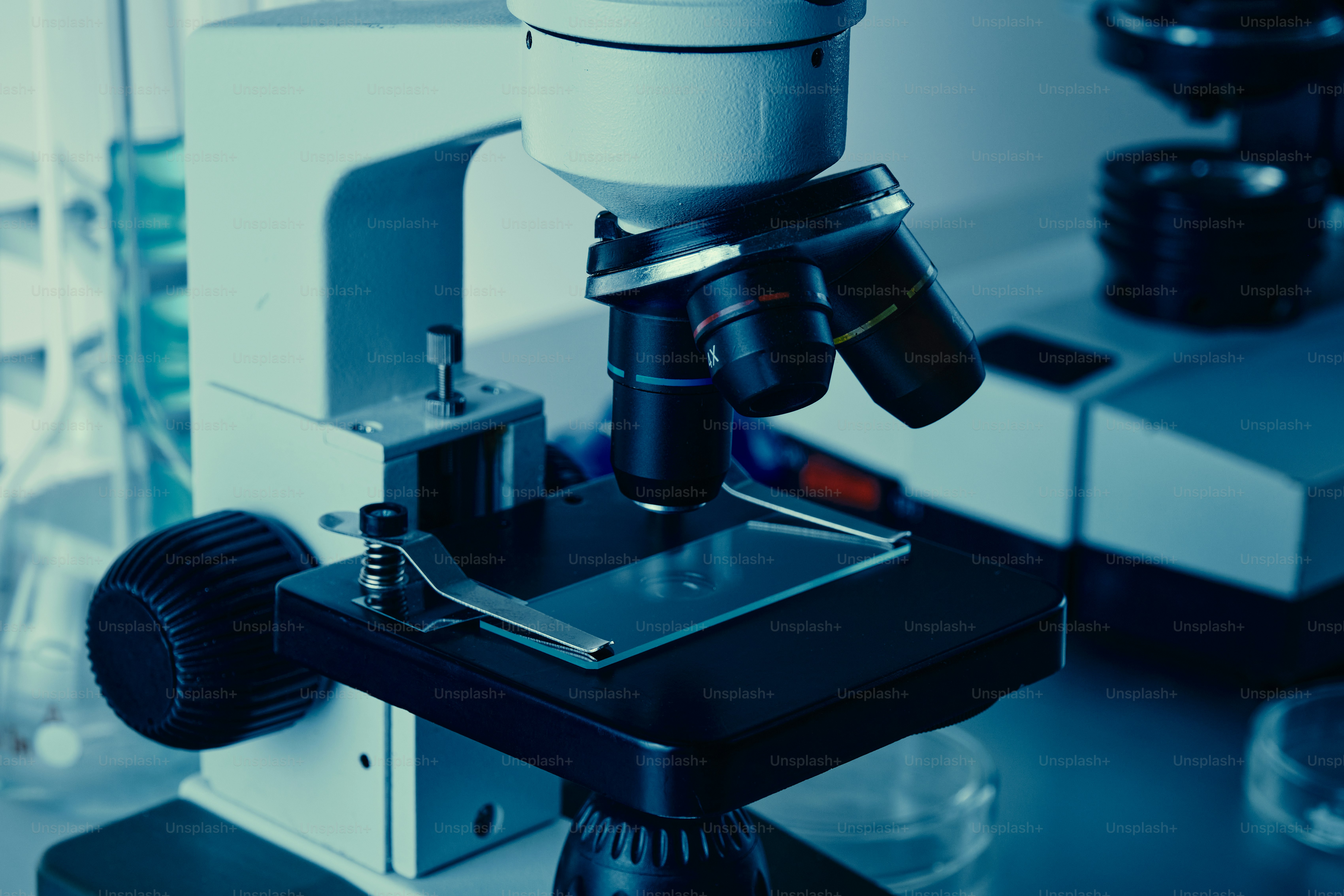 Microscope with slide in laboratory setting photo – Education Image on ...