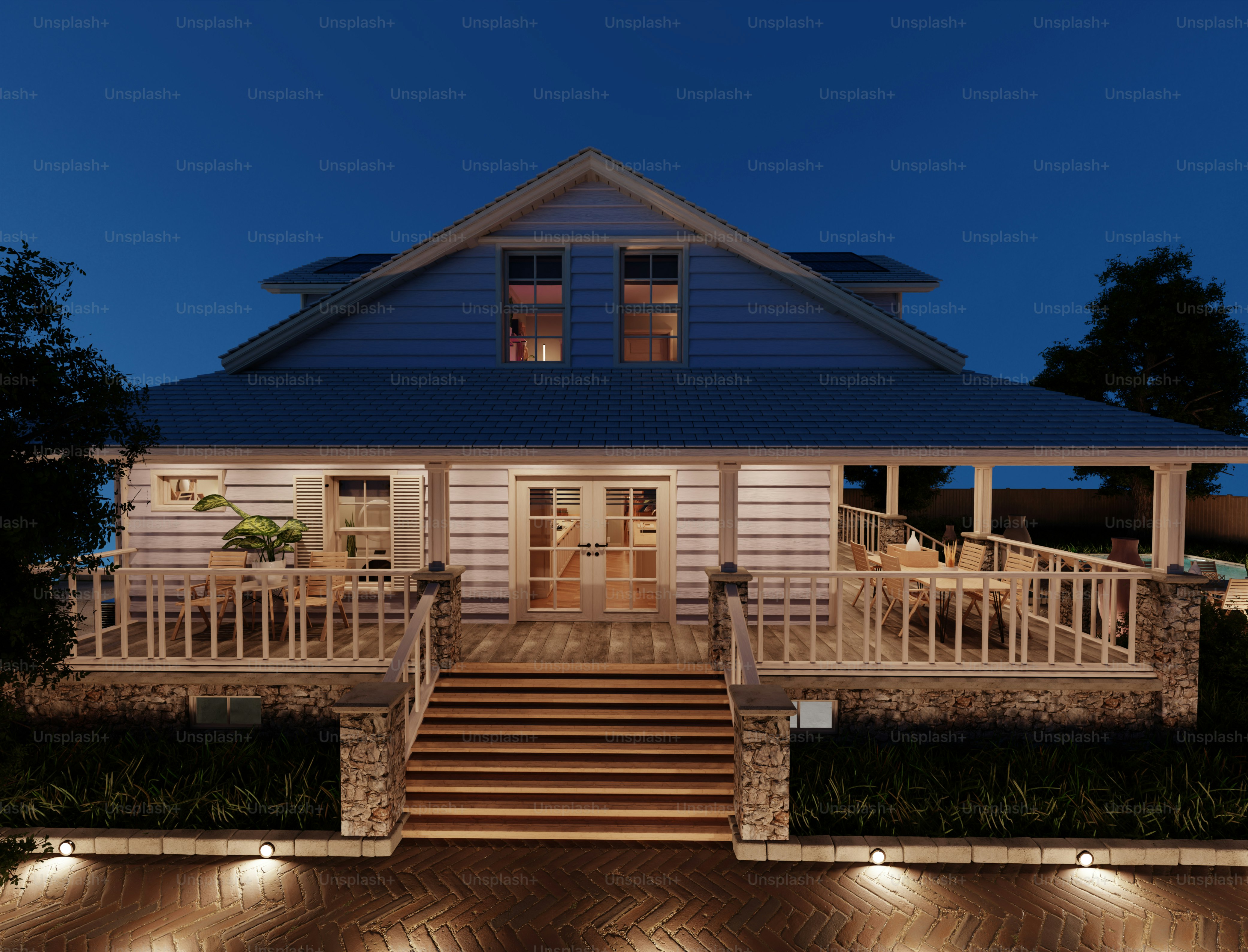 A white house with a porch at night