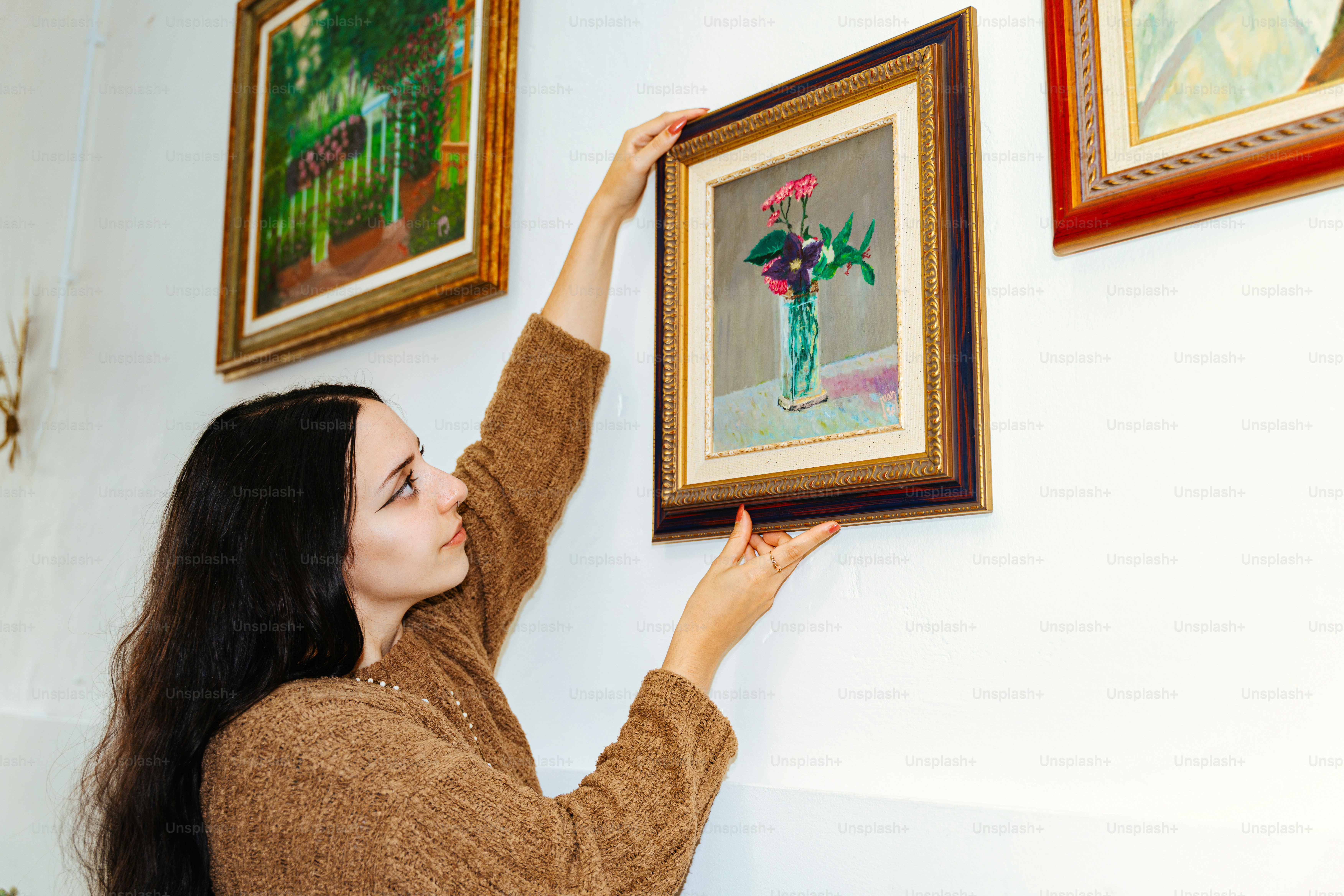 Homemade wall art arrangement with framed pieces creating stylish room decor