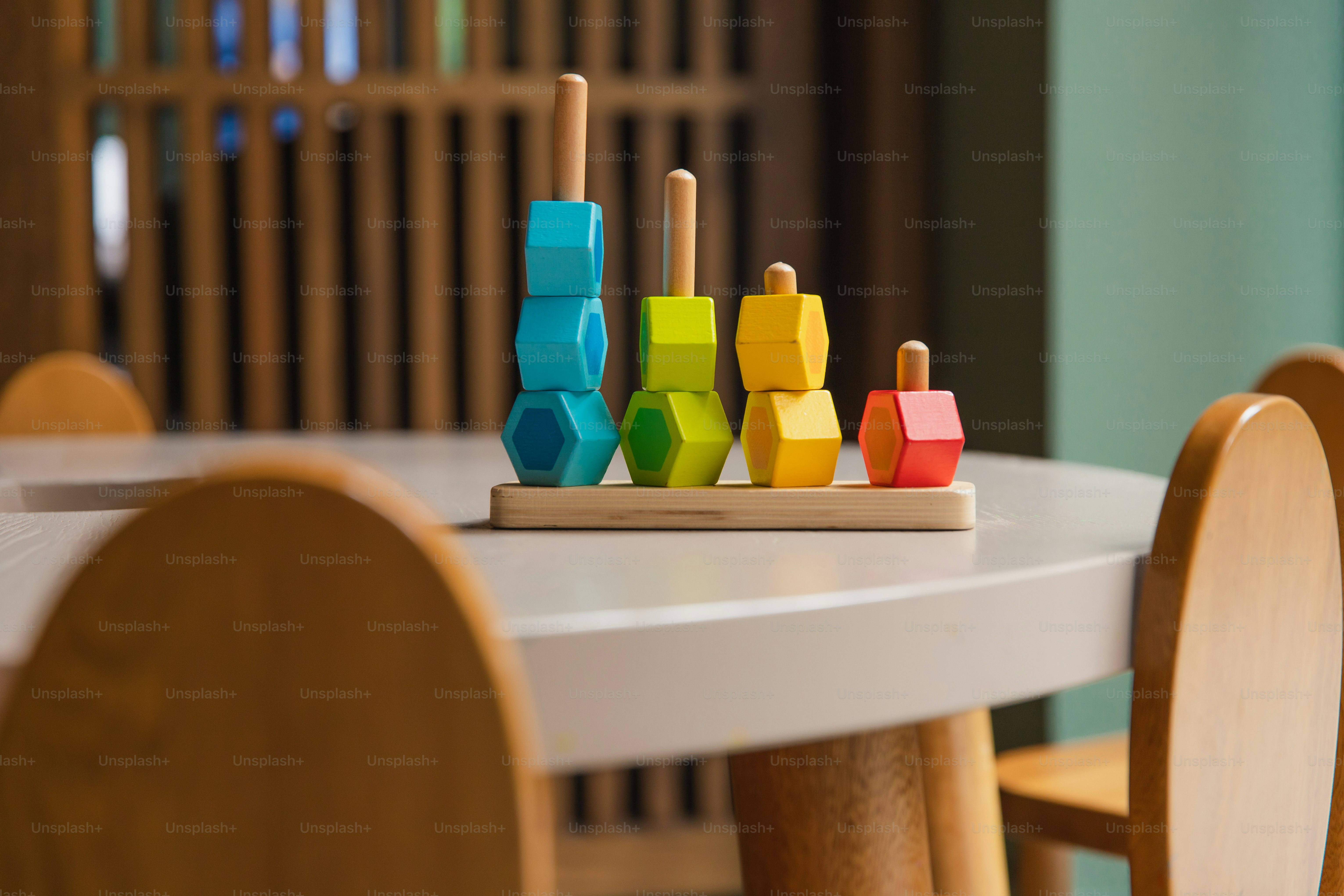 Colorful wooden stacking toy on a table.