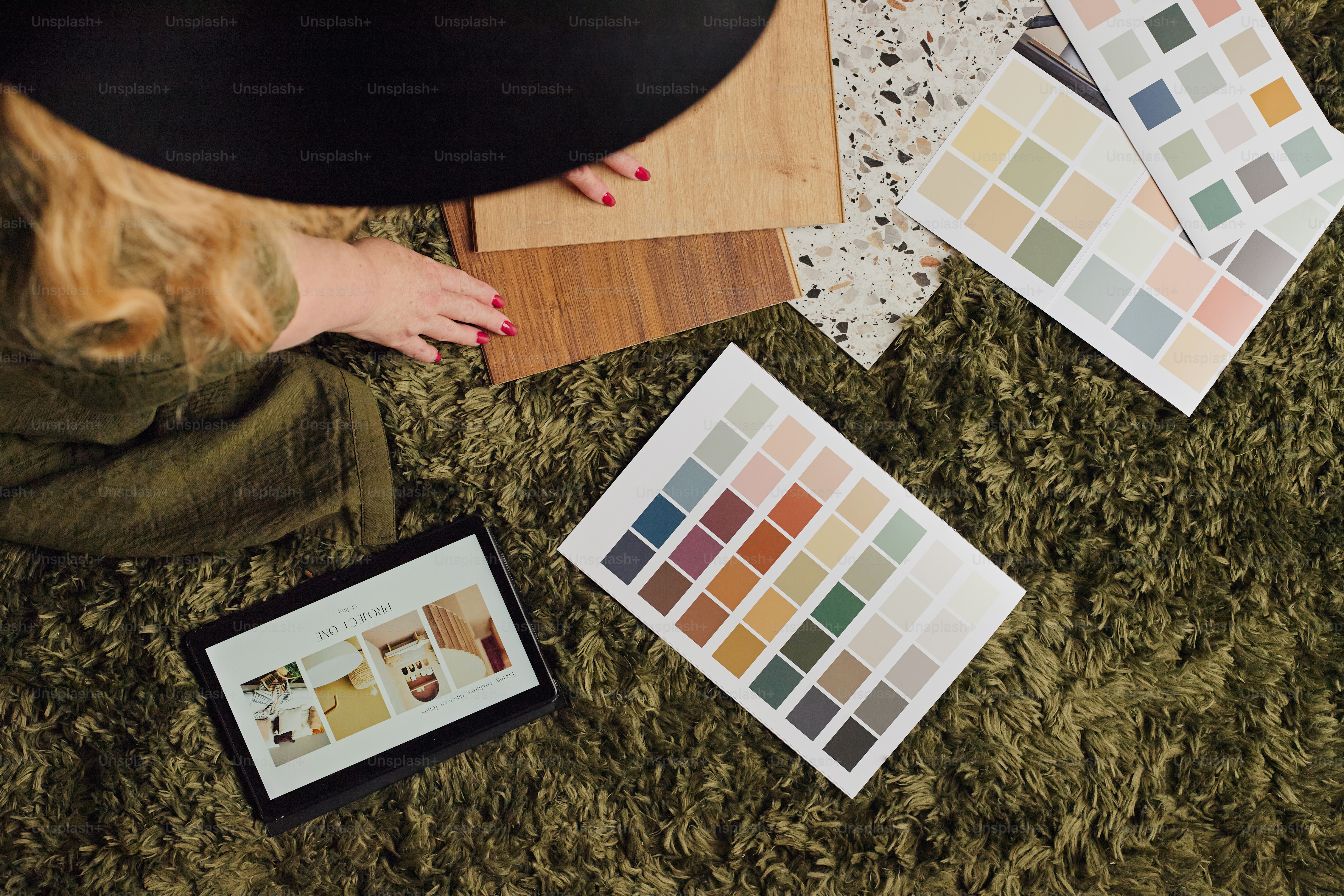 Designer choosing paint colors and wood samples.