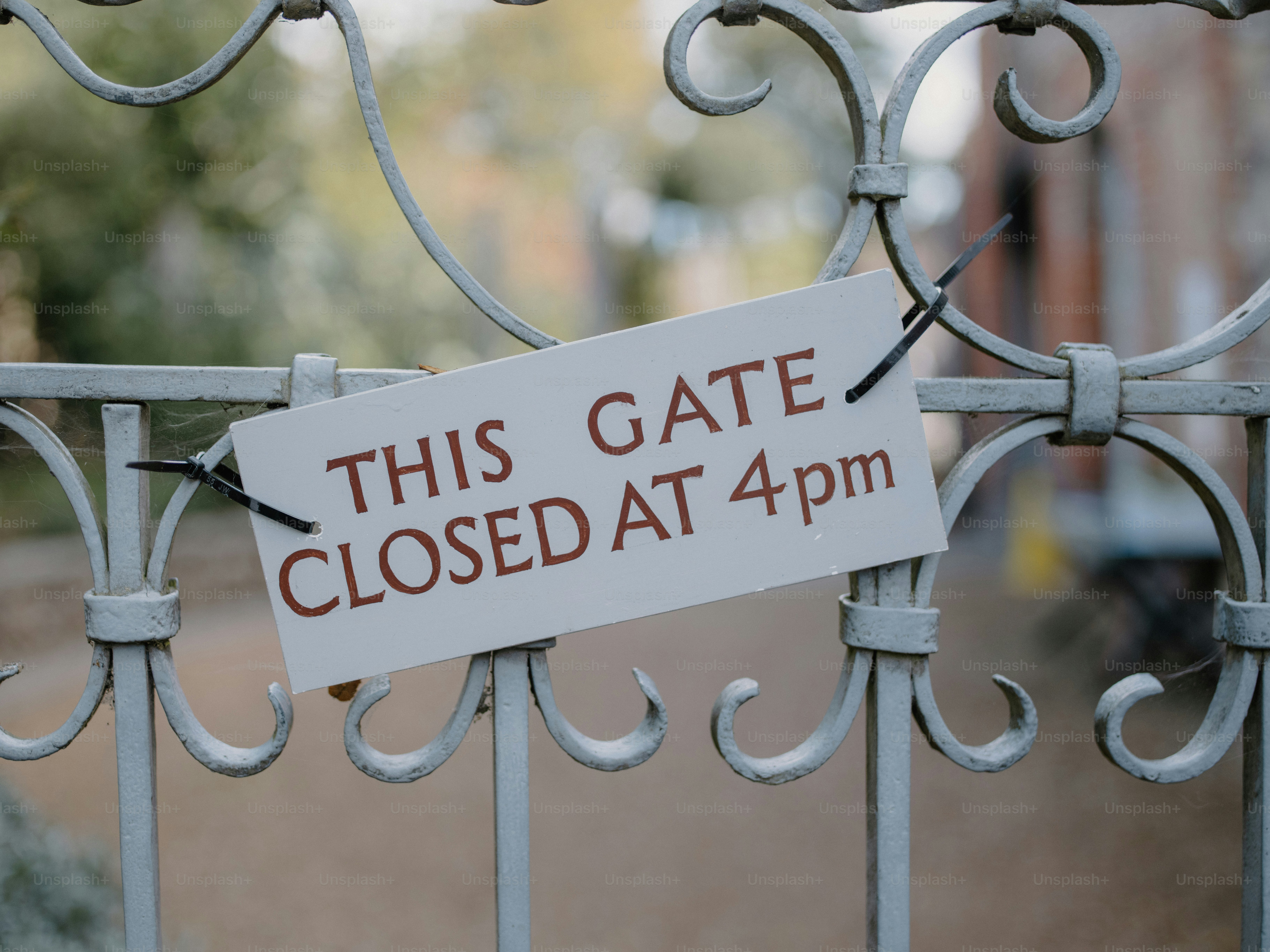 Gate with sign: this gate closed at 4pm