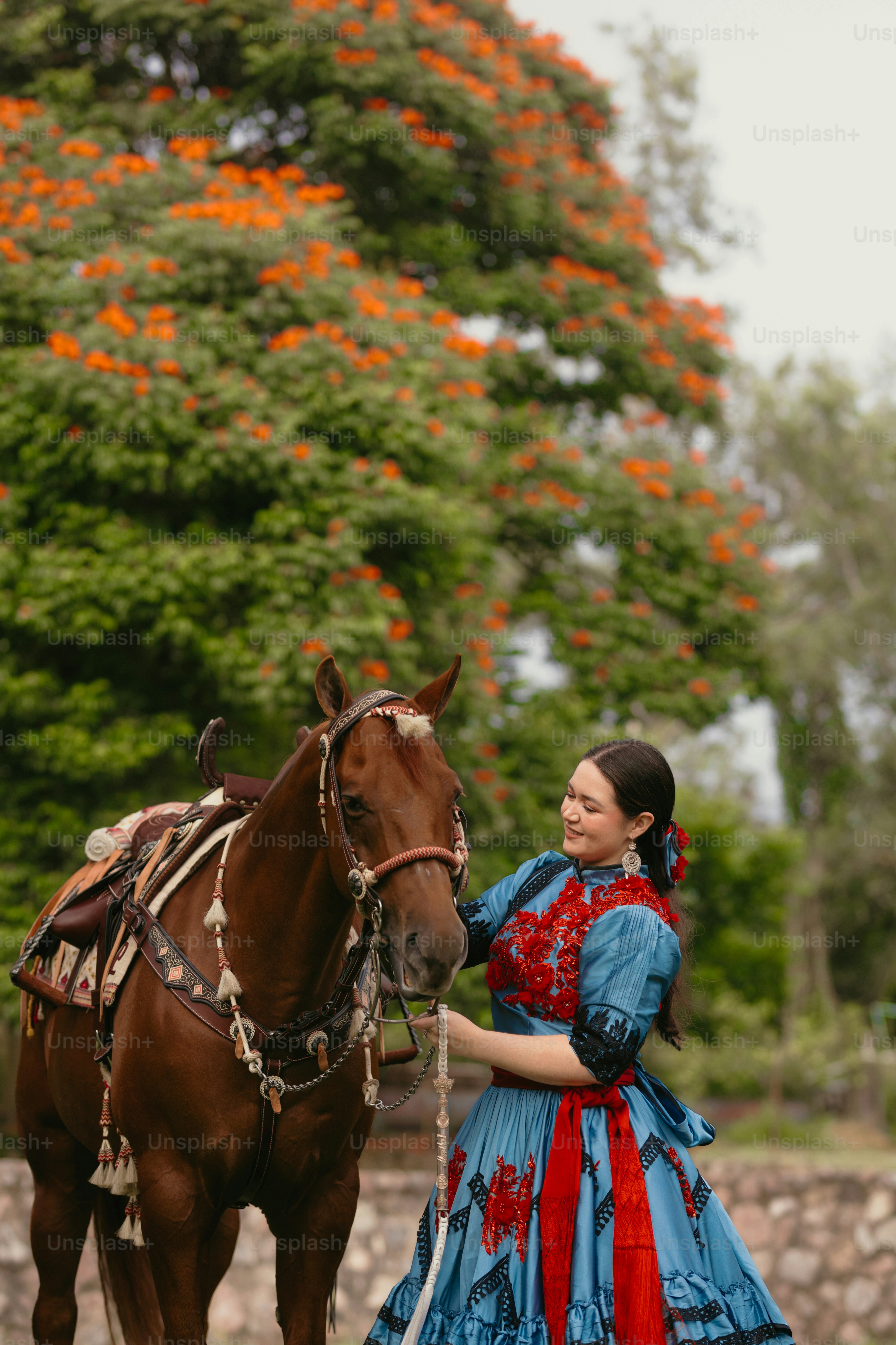 Woman in traditional dress riding a horse photo – Western Image on Unsplash