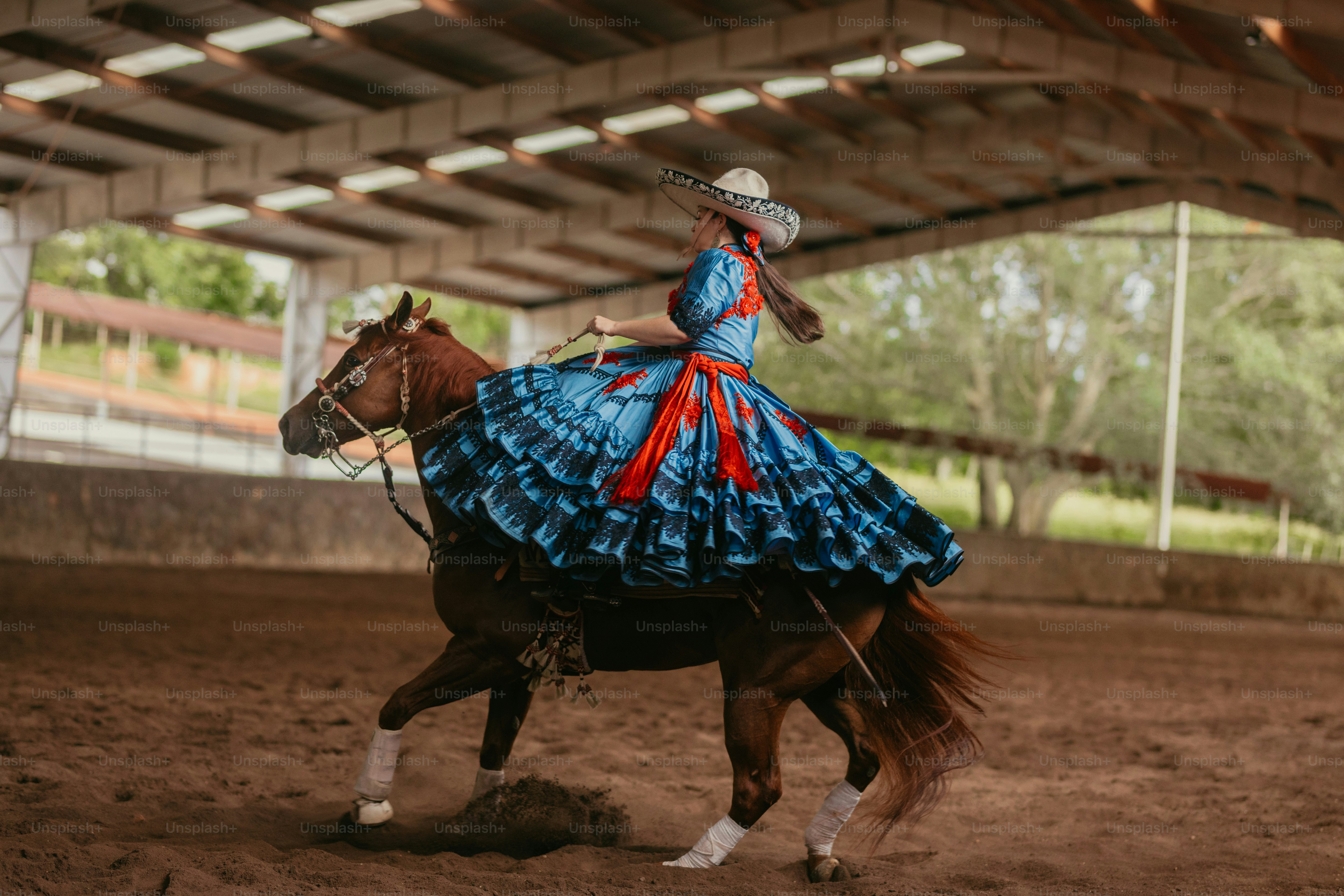 Woman in traditional dress riding a horse photo – Western Image on Unsplash